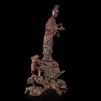 A large Chinese carved rootwood figural group depicting a meiren and monkeys 根雕美人与顽猴 Qing Dynasty ?