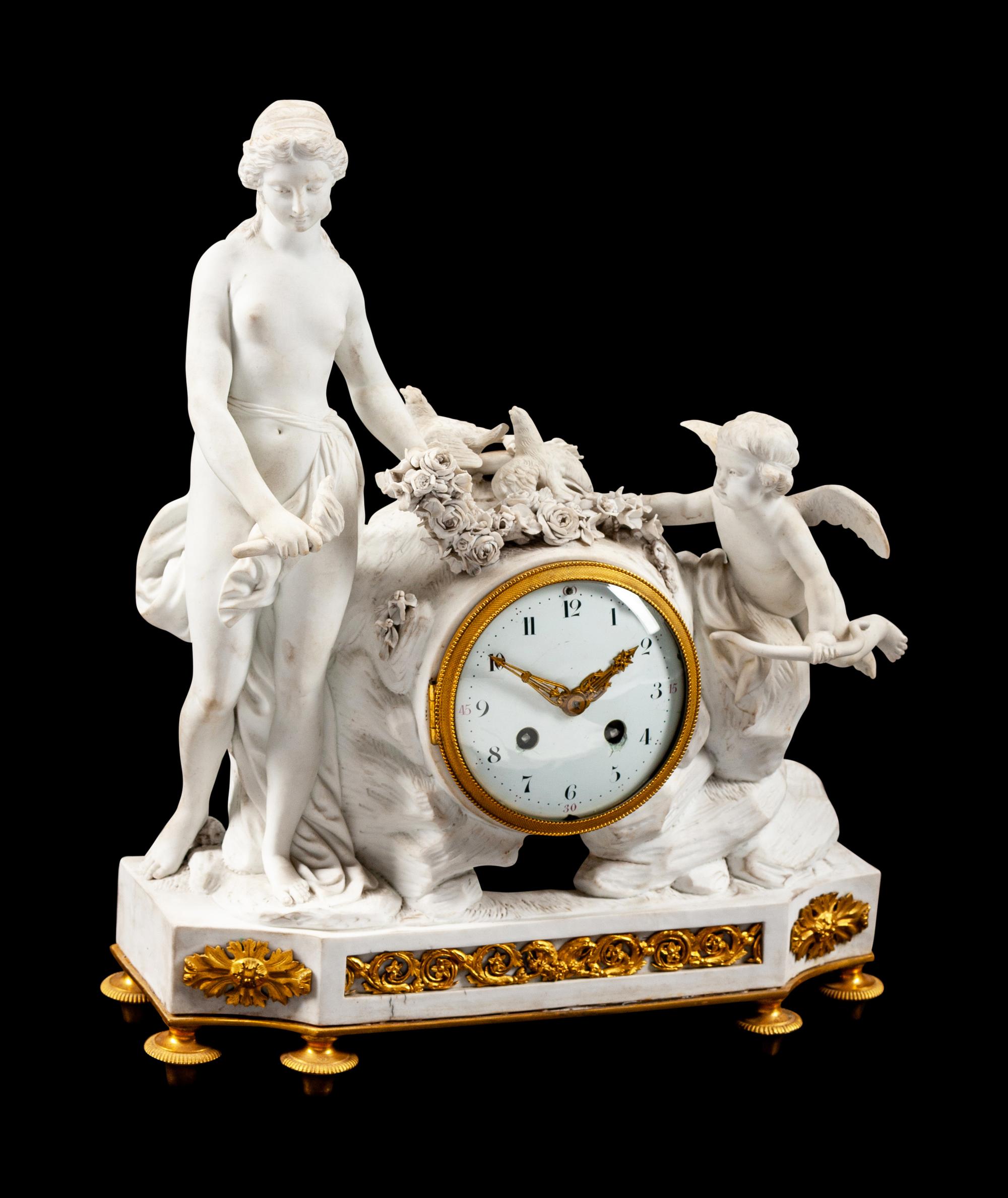 A French Gilt Bronze and Bisque Porcelain Mantel Clock