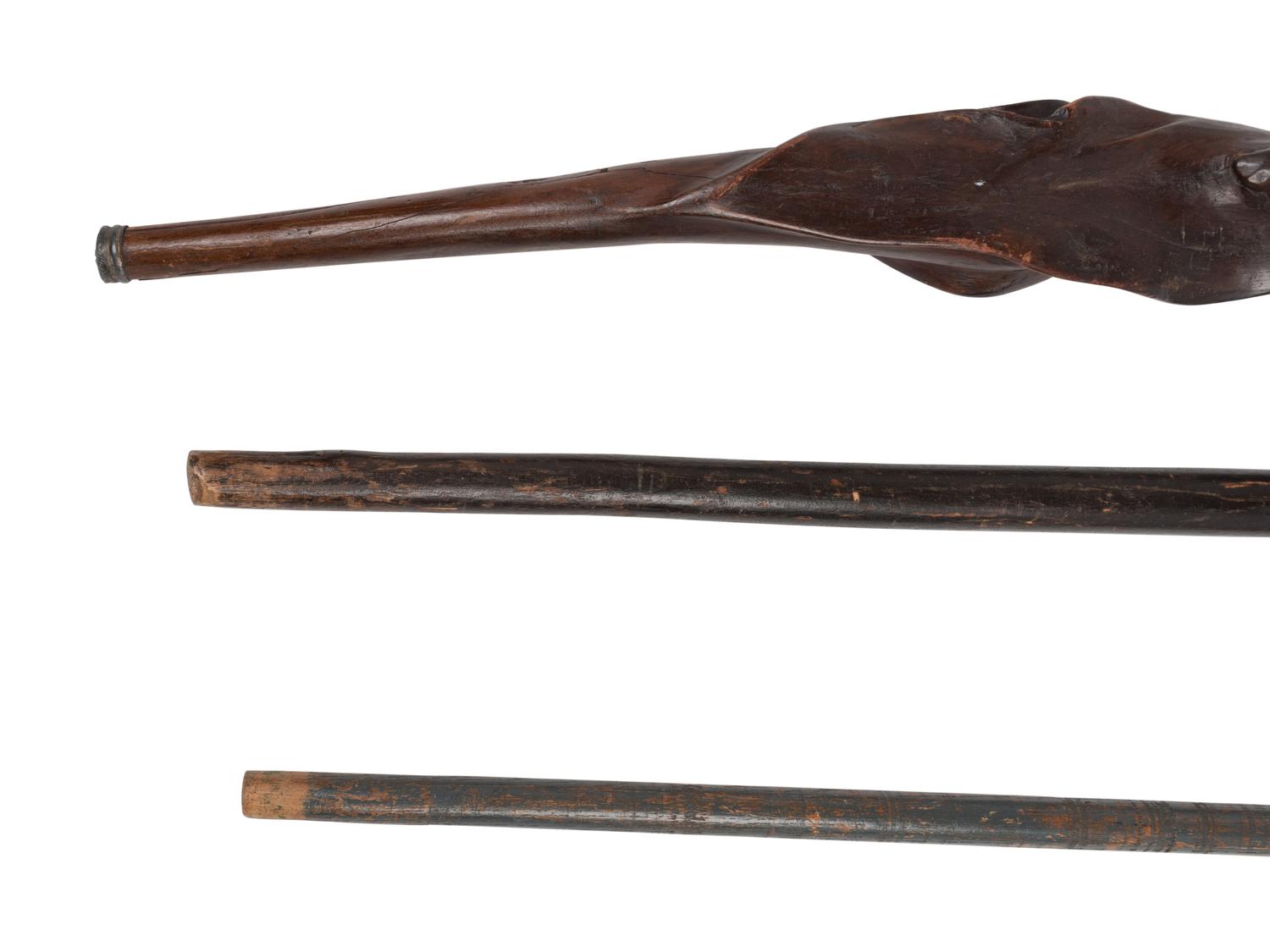 Three Carved Walnut Walking Sticks