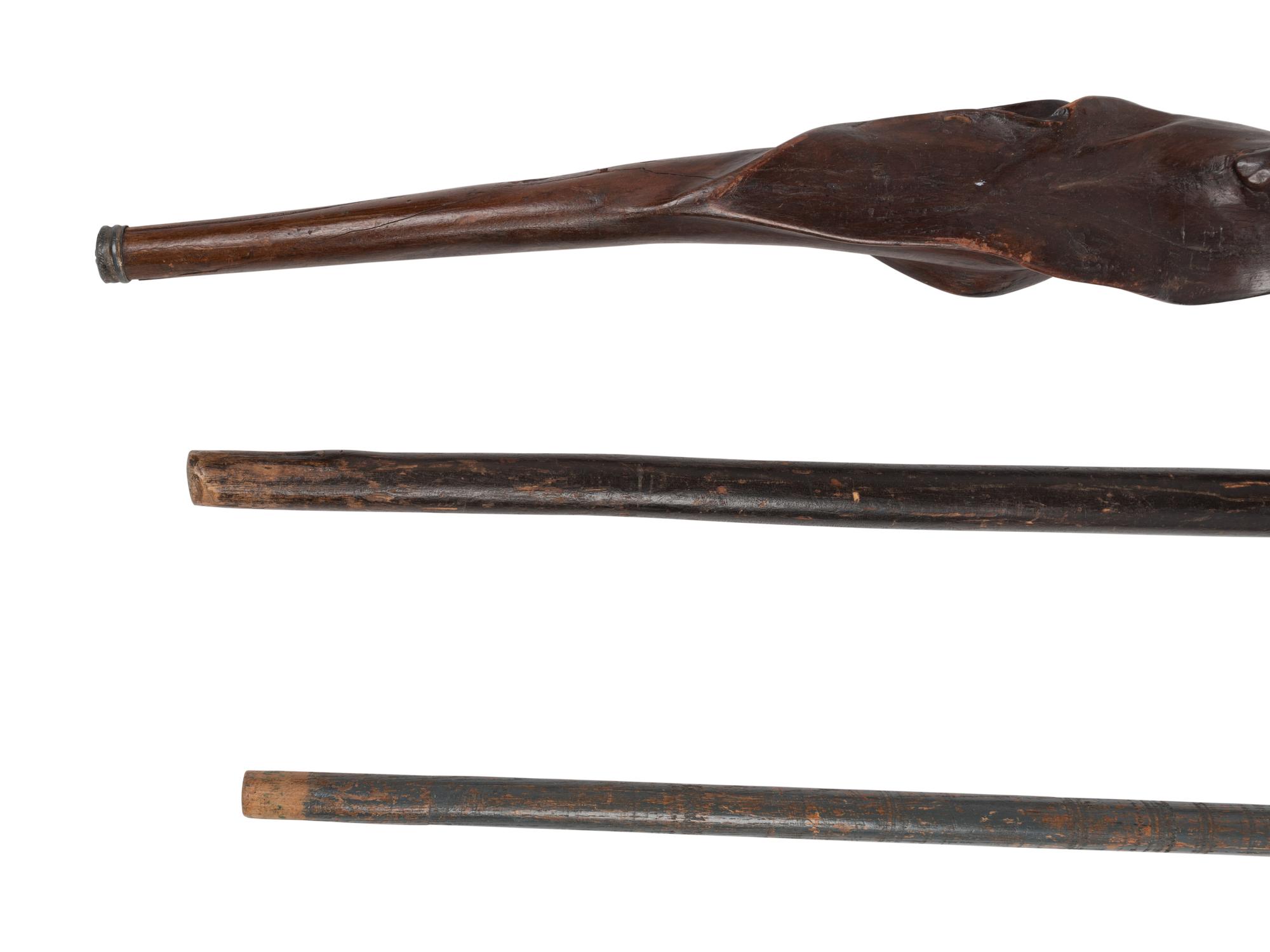 Three Carved Walnut Walking Sticks