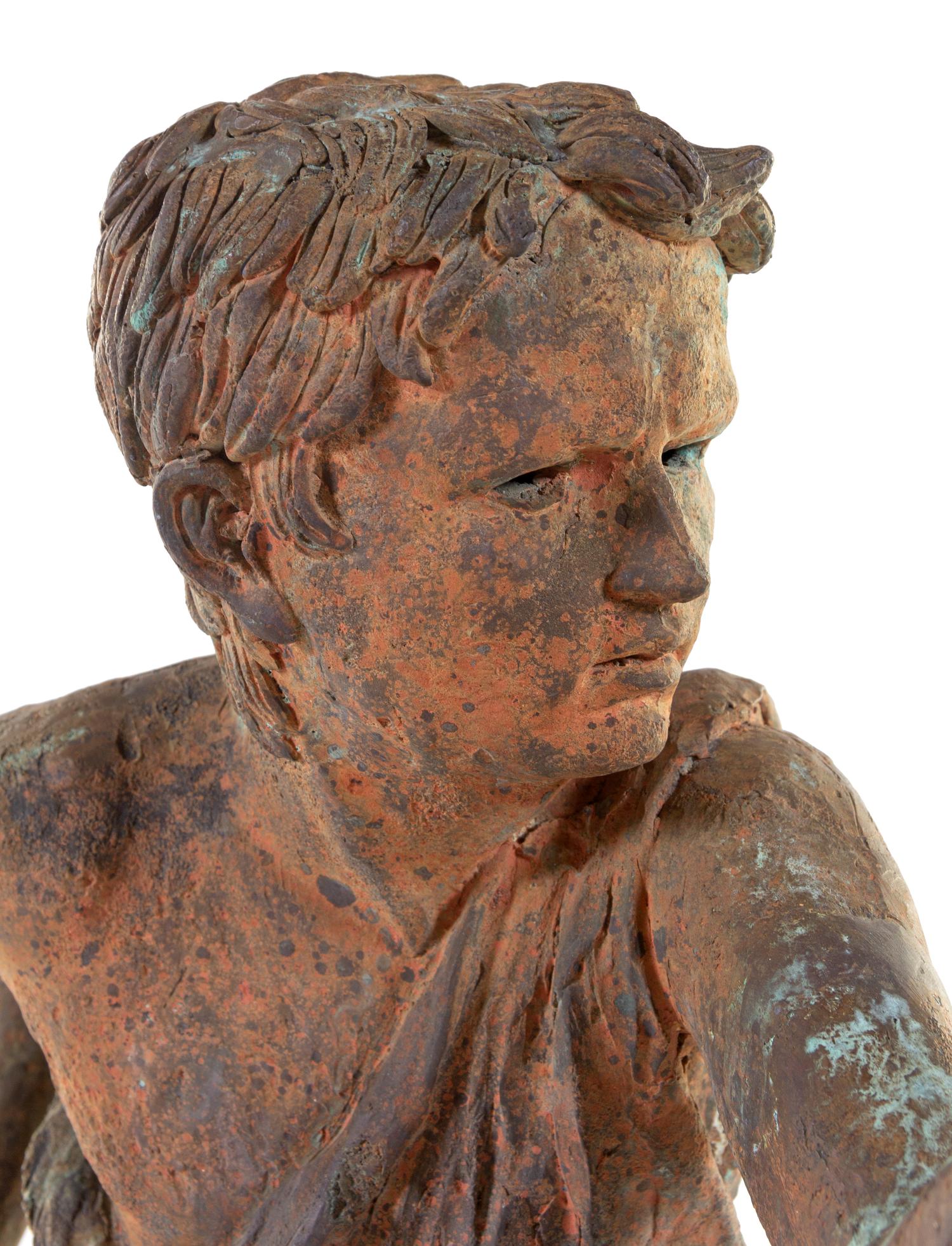 A Patinated Bronze Figure of a Boy