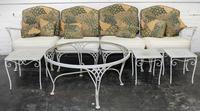 A Woodard Enameled Patio Set Height of circular table 18 x diameter 36 1/4 inches.