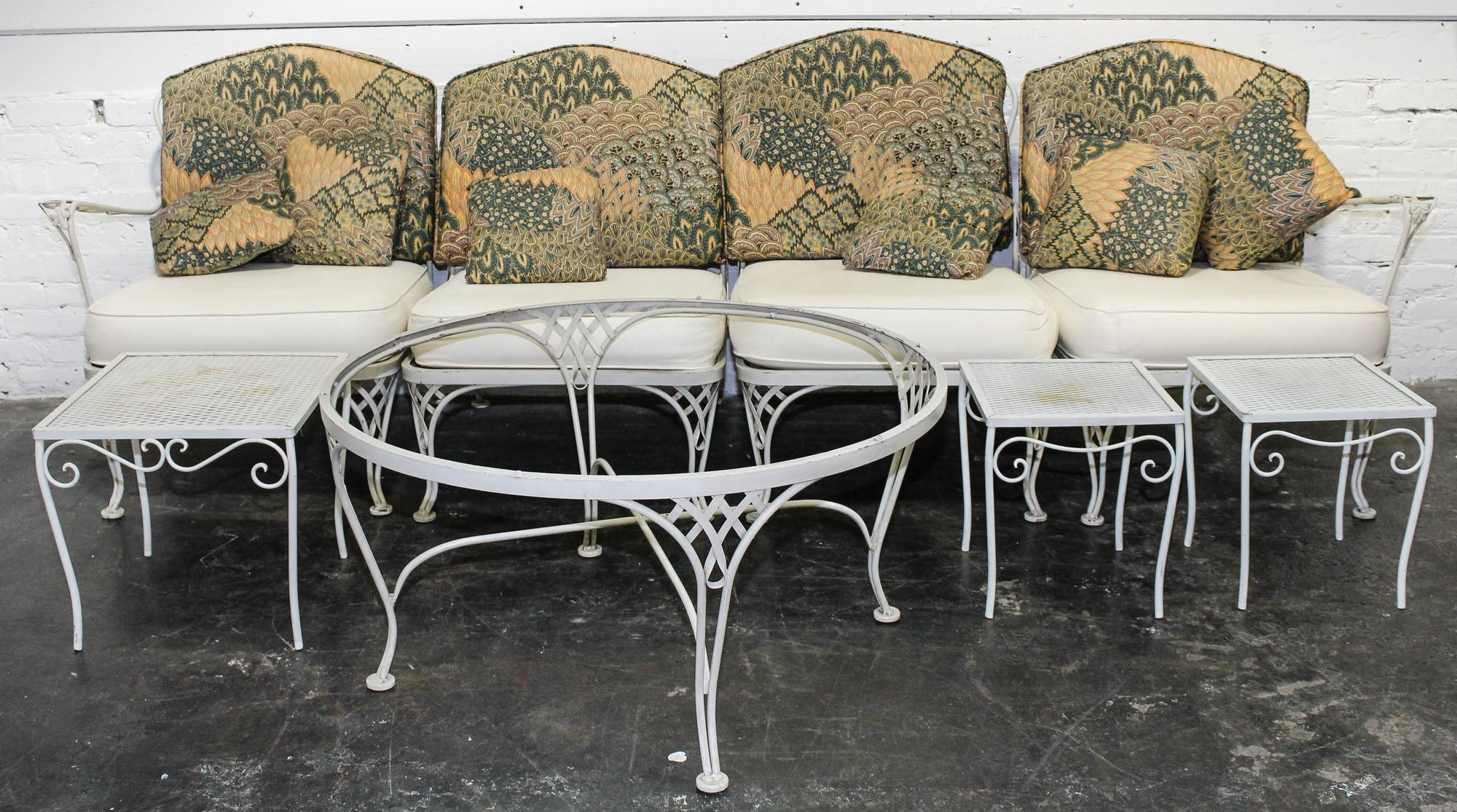 A Woodard Enameled Patio Set Height of circular table 18 x diameter 36 1/4 inches.