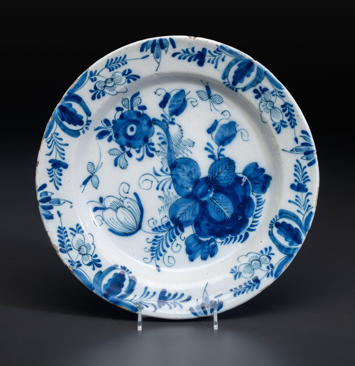 A Floral Decorated Delftware Charger