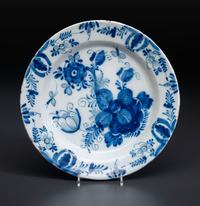 A Floral Decorated Delftware Charger