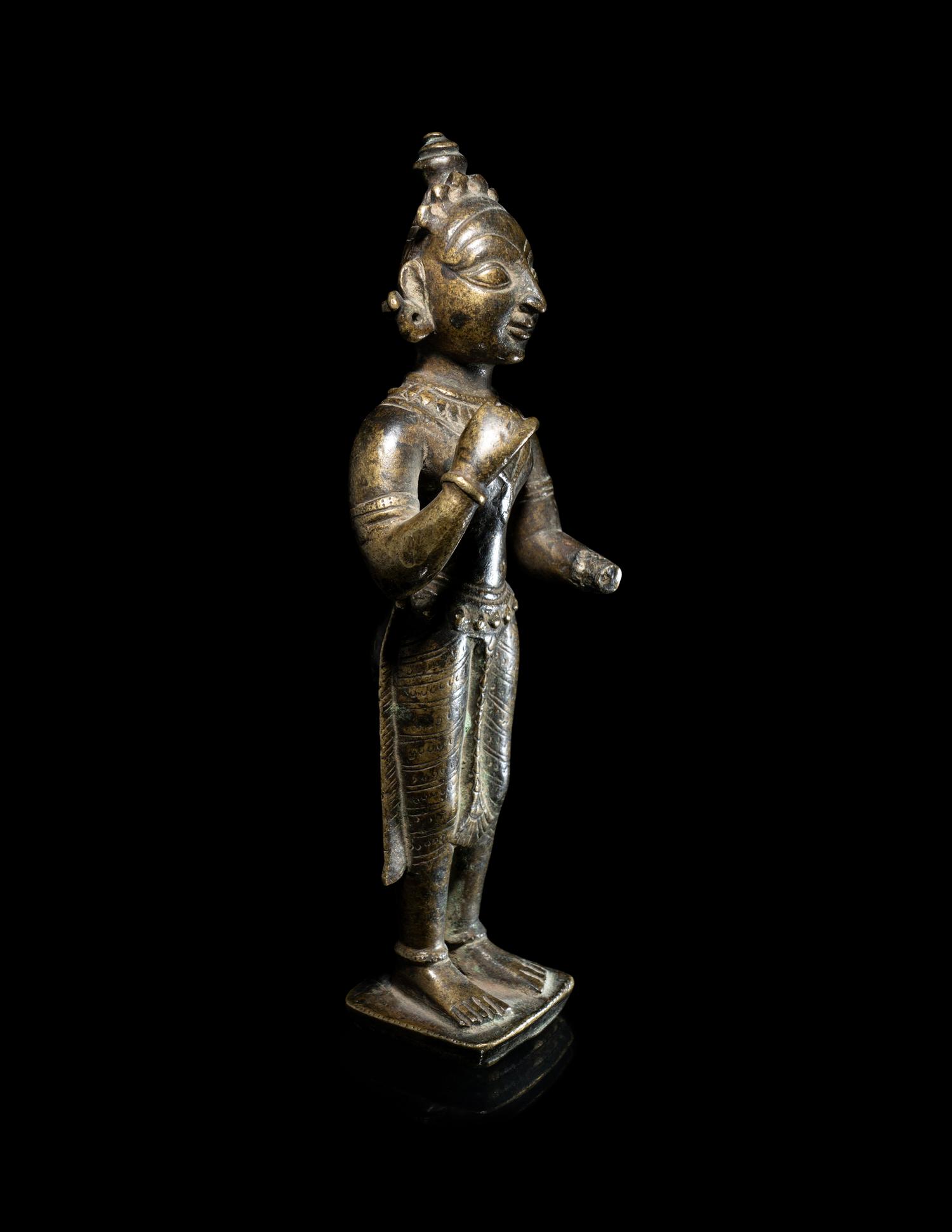 An Indian Bronze Figure of a Standing Female Attendant