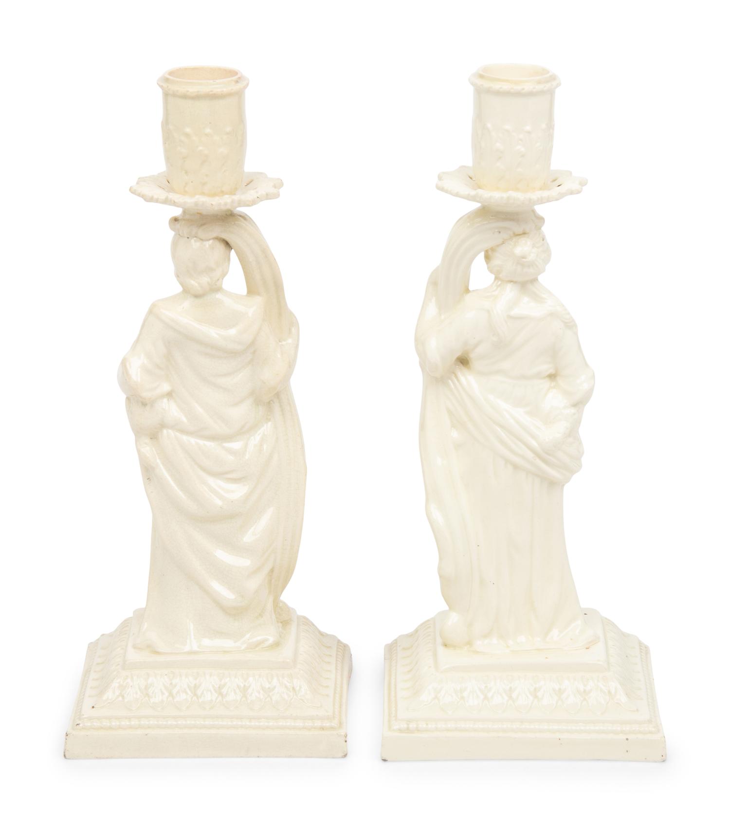 A Pair of English Creamware Figural Candlesticks