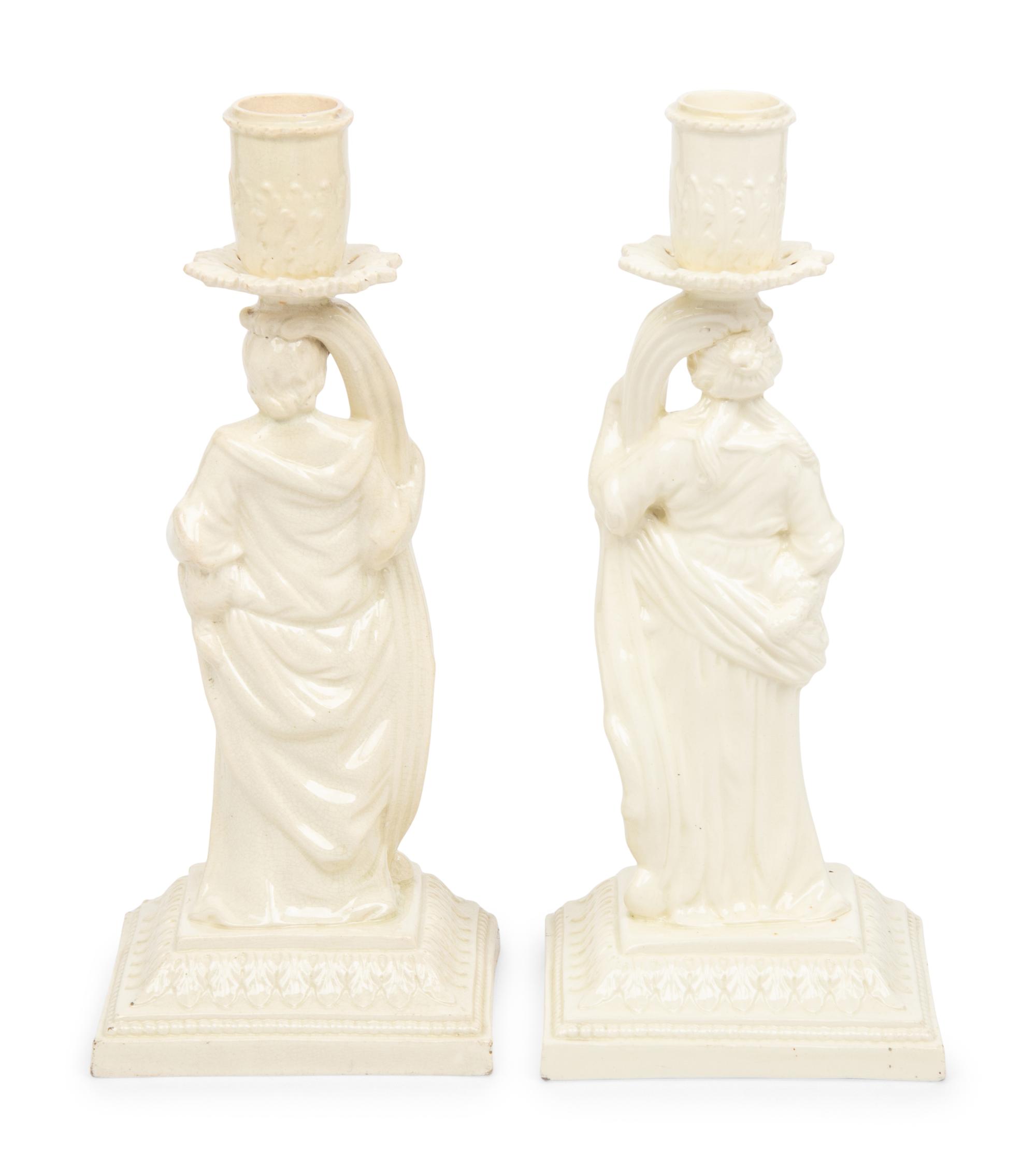 A Pair of English Creamware Figural Candlesticks