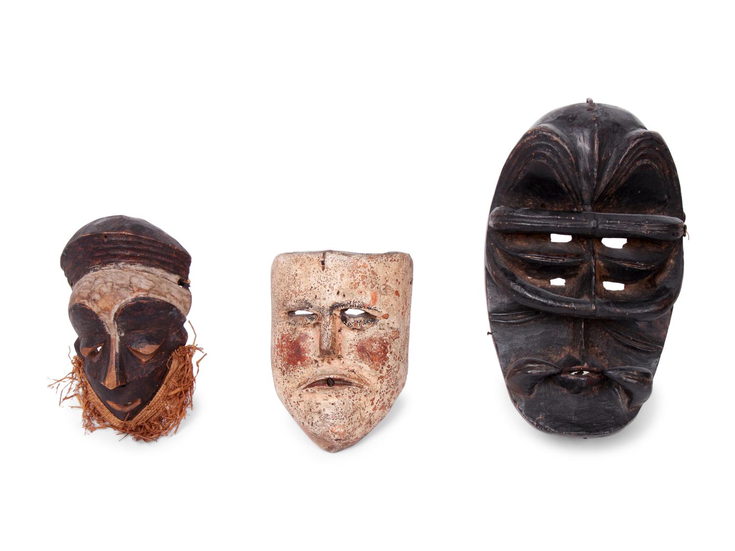 A Group of Ten Carved Ethnographic Masks