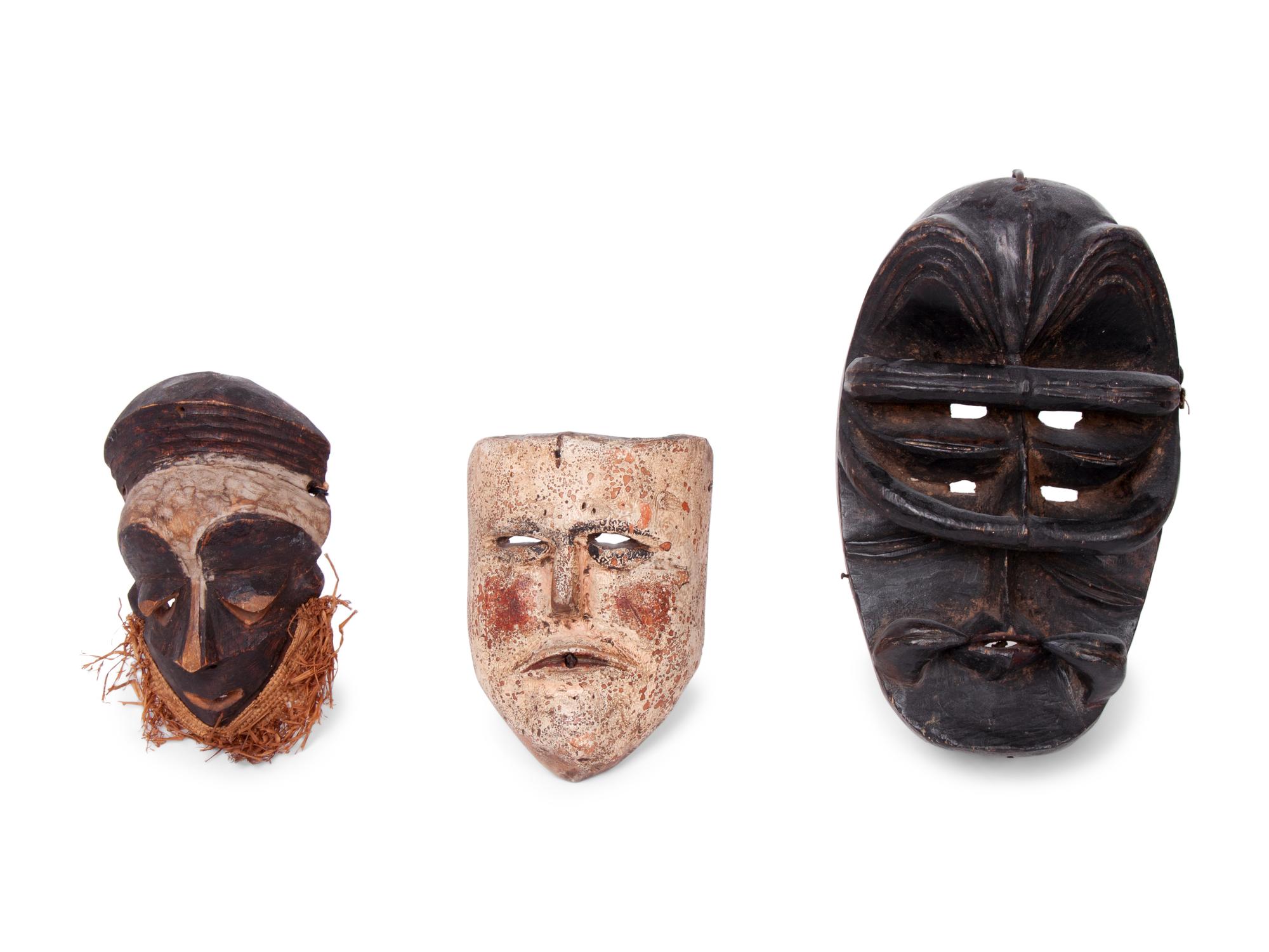 A Group of Ten Carved Ethnographic Masks