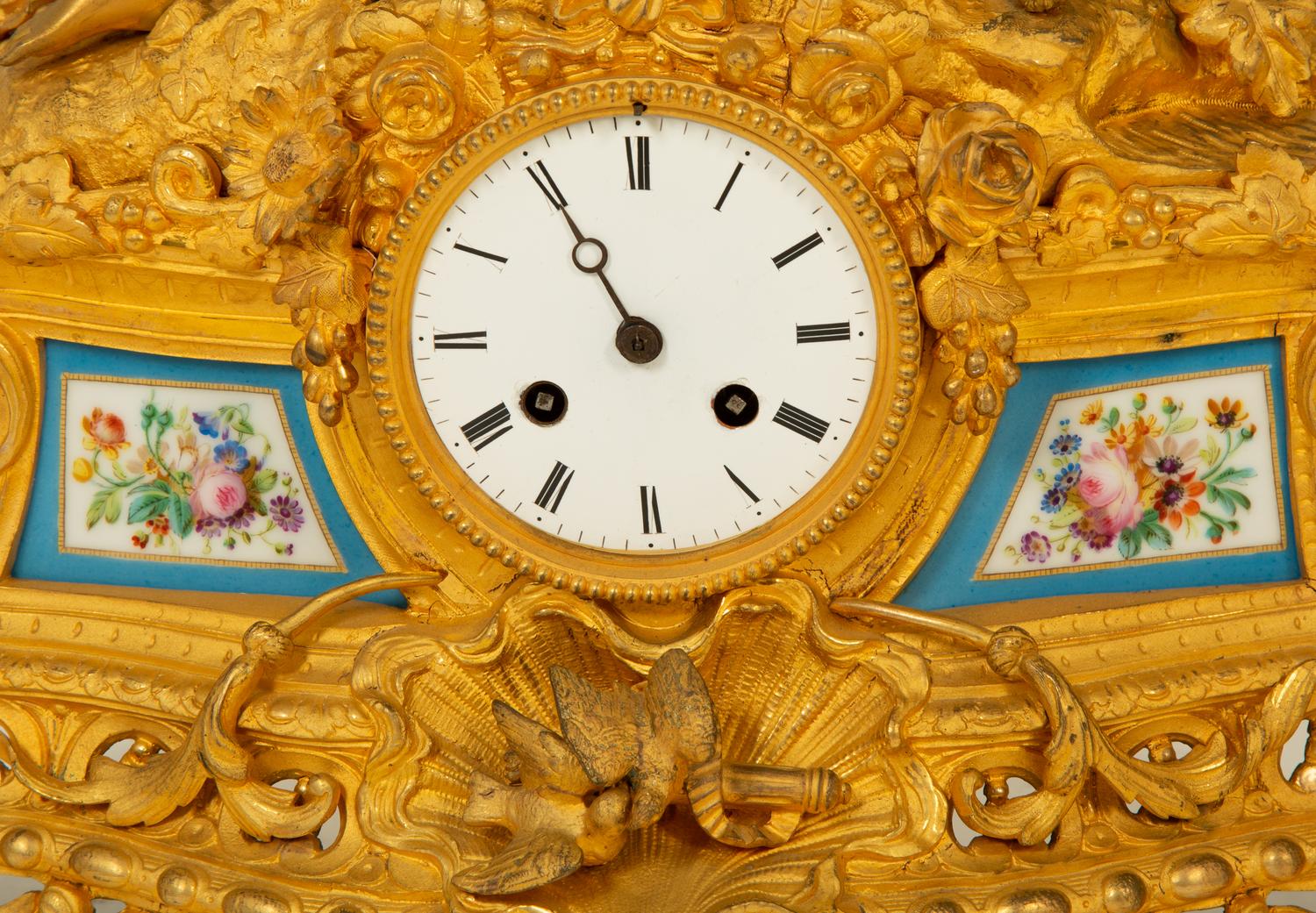 A Louis XV Style Gilt Bronze and Porcelain Inset Mantel Clock — 19TH CENTURY