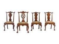 A Group of Four Chippendale Carved Walnut Side Chairs