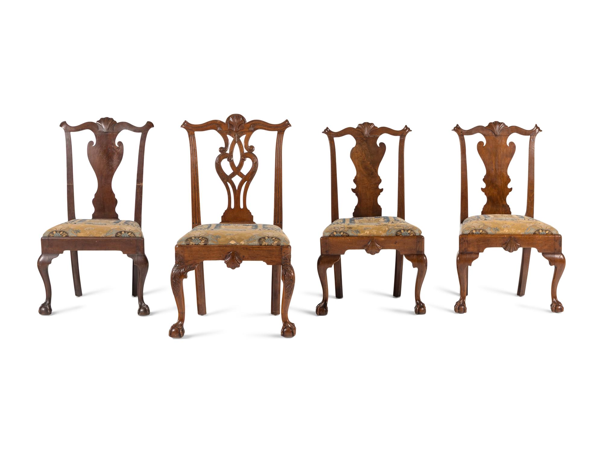 A Group of Four Chippendale Carved Walnut Side Chairs