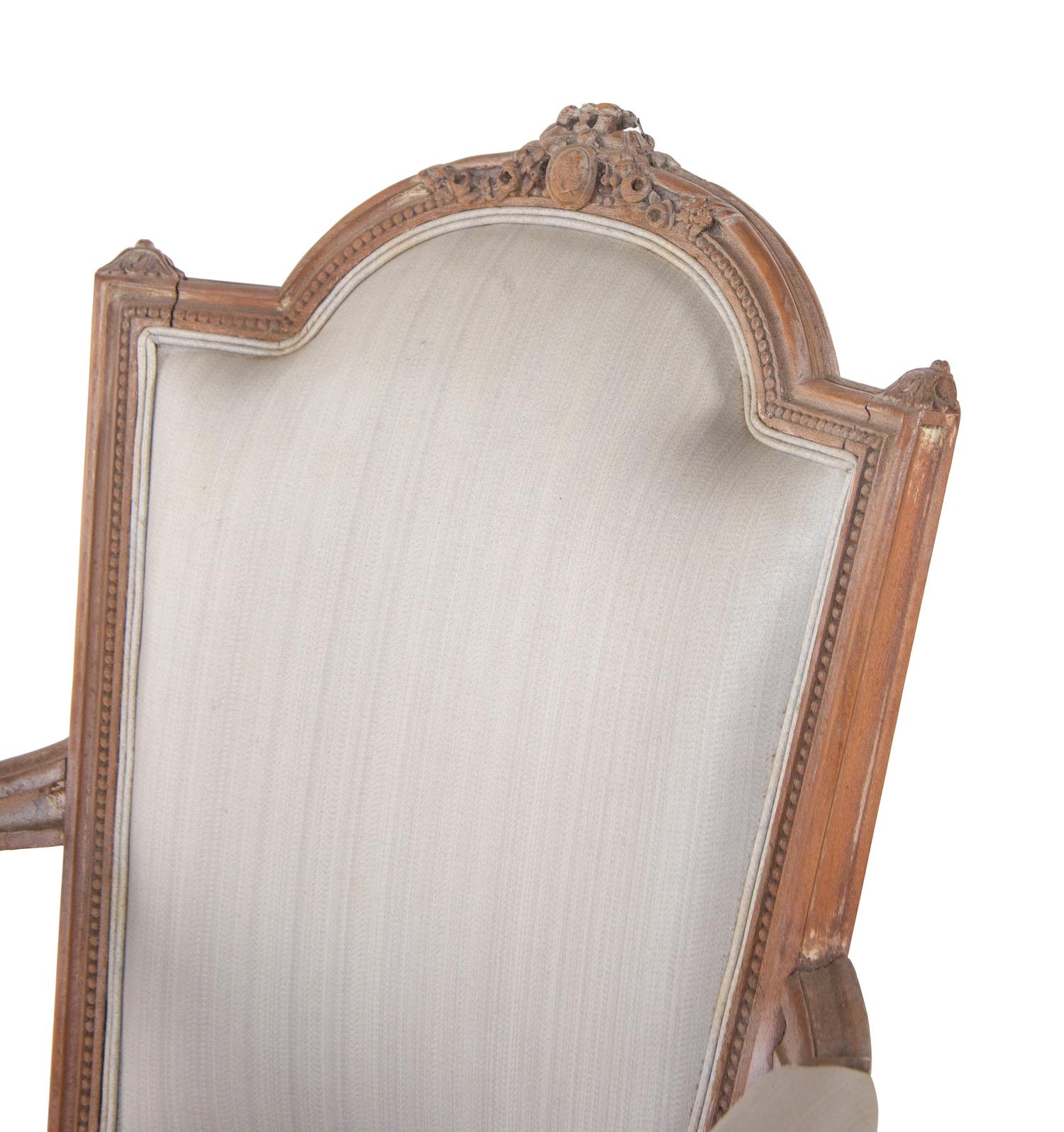 A Pair of Louis XVI Limed Beech Fauteuils