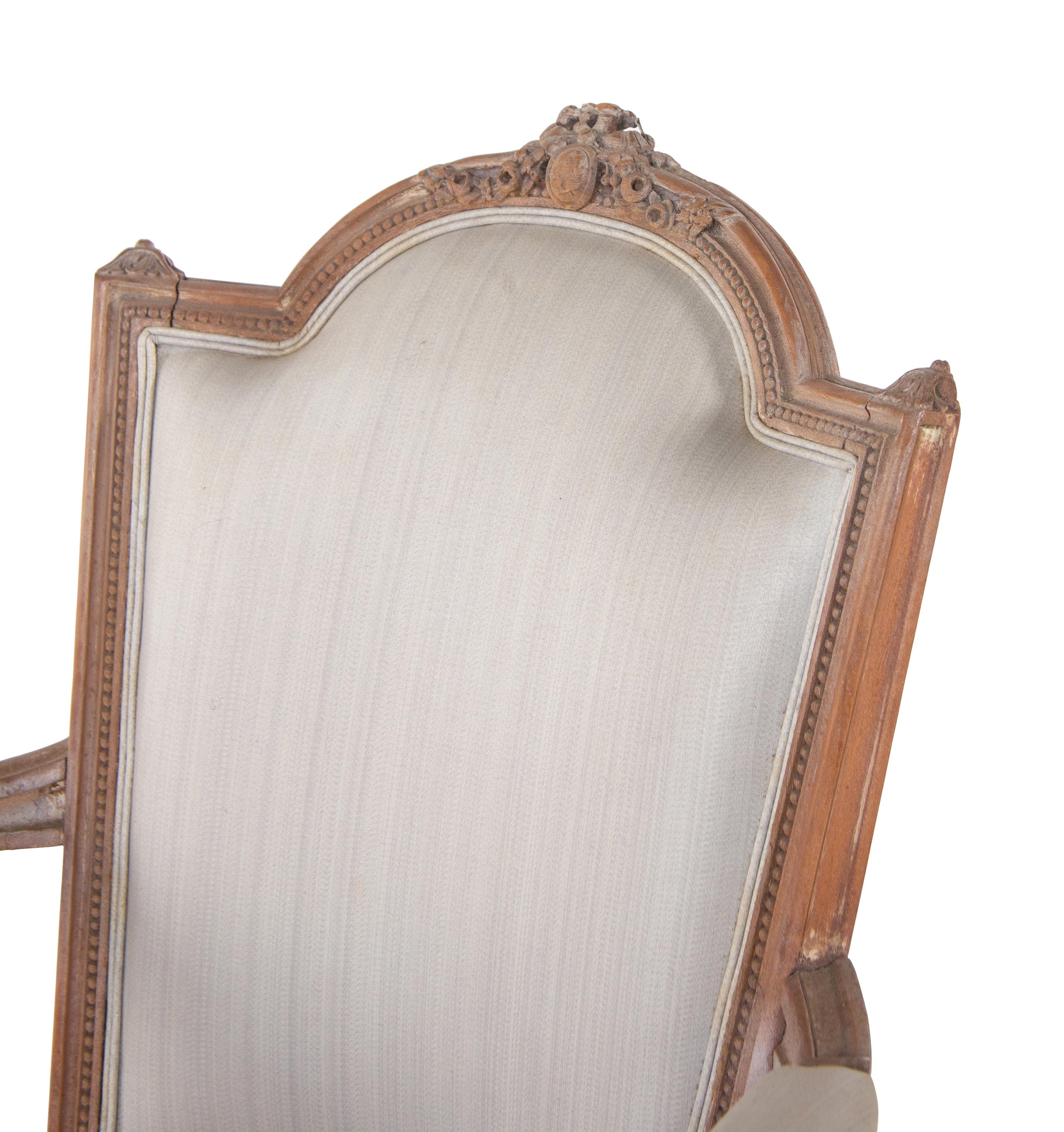 A Pair of Louis XVI Limed Beech Fauteuils