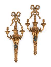 A Pair of Louis XVI Style Gilt and Patinated Metal Three-Light Sconces