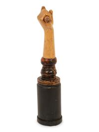 A Folk Art Carved and Polychrome Painted Hand Clutching a Hammer