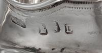 A George III Irish Silver Creamer, Dublin, Circa 1800, maker's mark rubbed, possibly G&PW, having incised floral decoration.