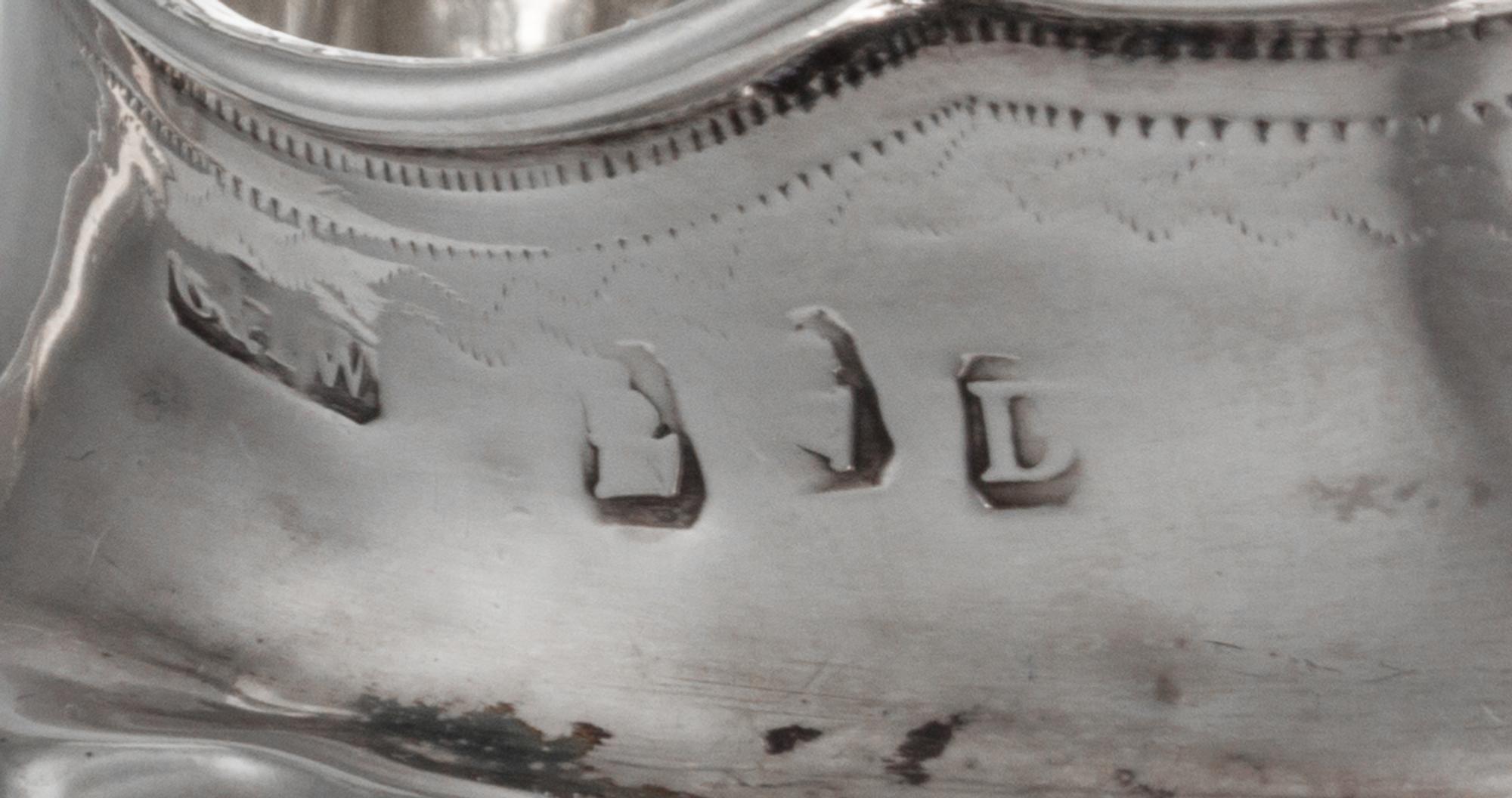 A George III Irish Silver Creamer, Dublin, Circa 1800, maker's mark rubbed, possibly G&PW, having incised floral decoration.