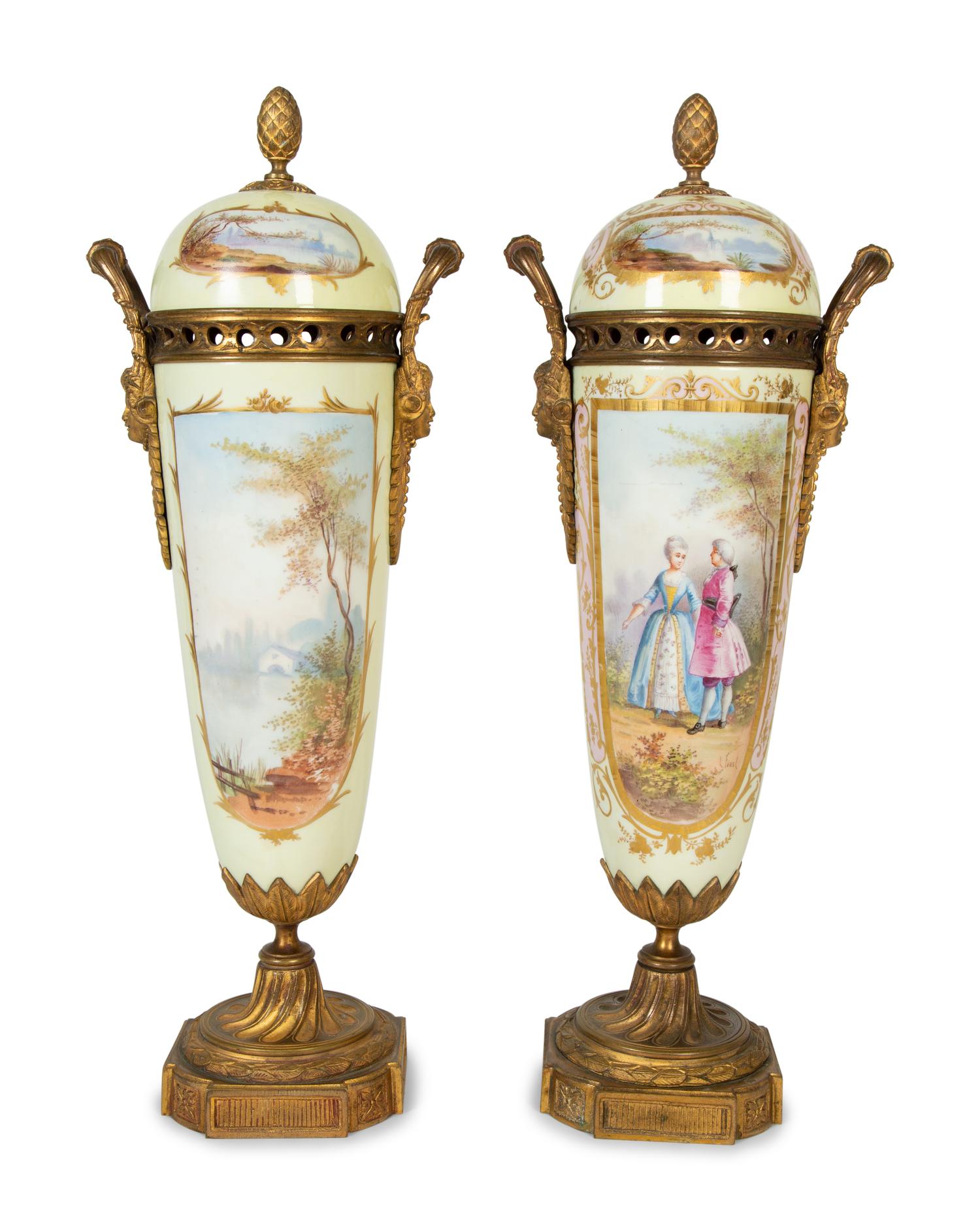 A Pair of Gilt Bronze Mounted Sèvres Style Porcelain Urns