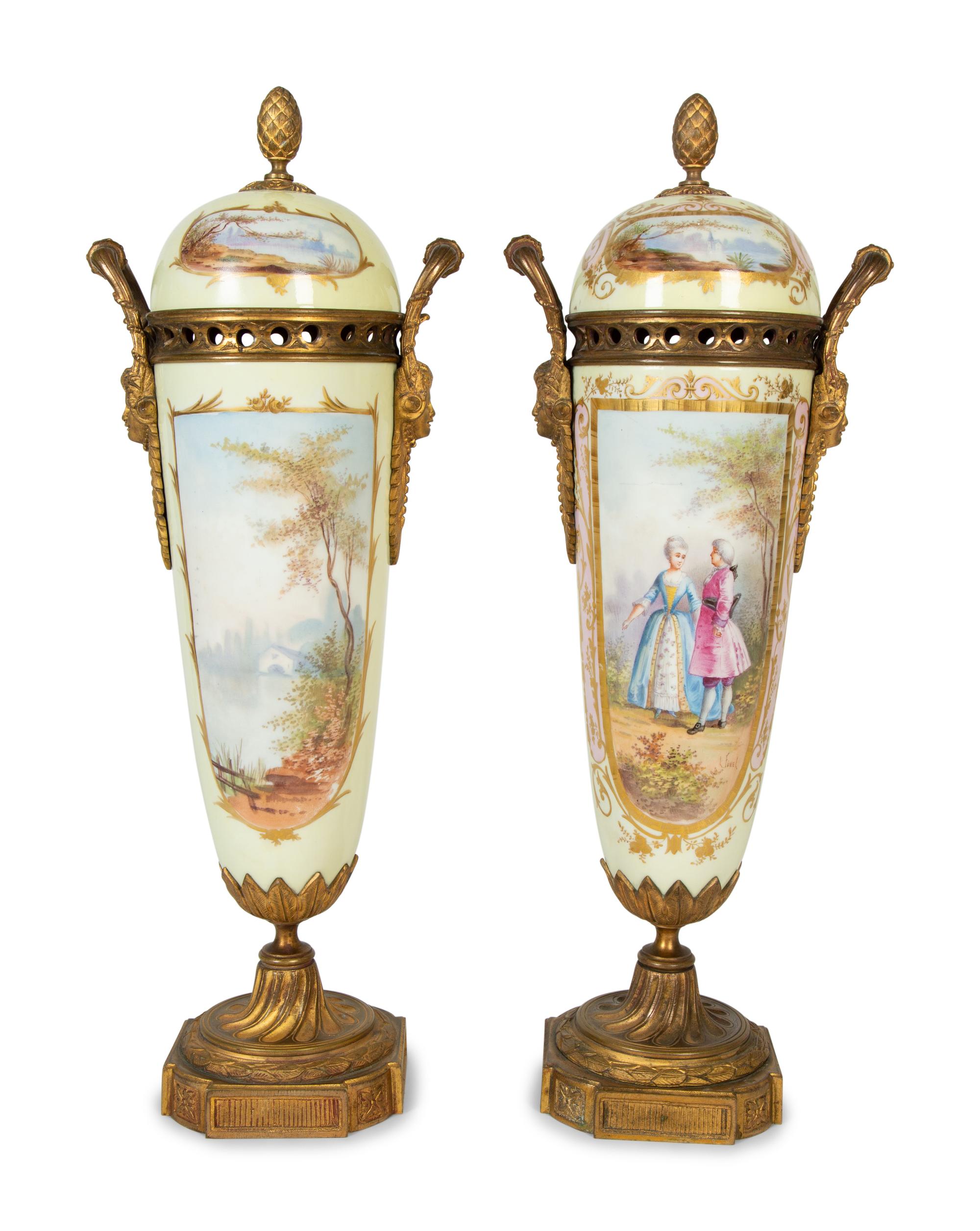 A Pair of Gilt Bronze Mounted Sèvres Style Porcelain Urns