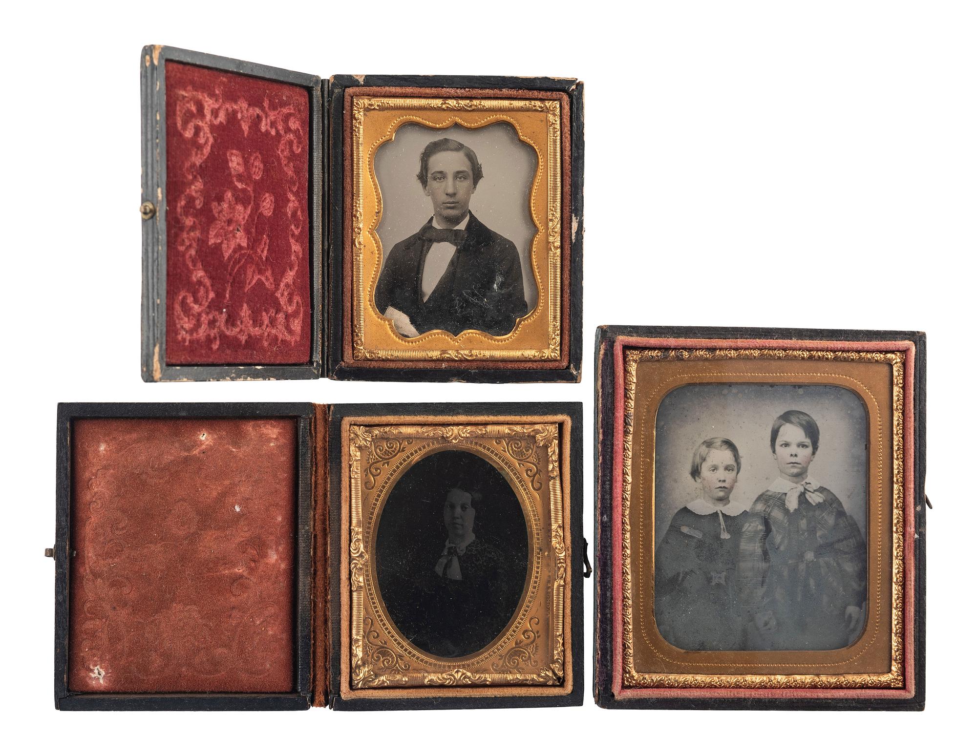 [EARLY PHOTOGRAPHY - PORTRAITURE]. A group of 21 assorted daguerreotypes, ambrotypes, tintypes, and CDVs of men, women, and children, with Kenosha, WI album with tintypes, CDVs, and cabinet cards.