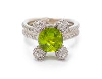 A White Gold, Peridot and Diamond Ring, 10.60 dwts.