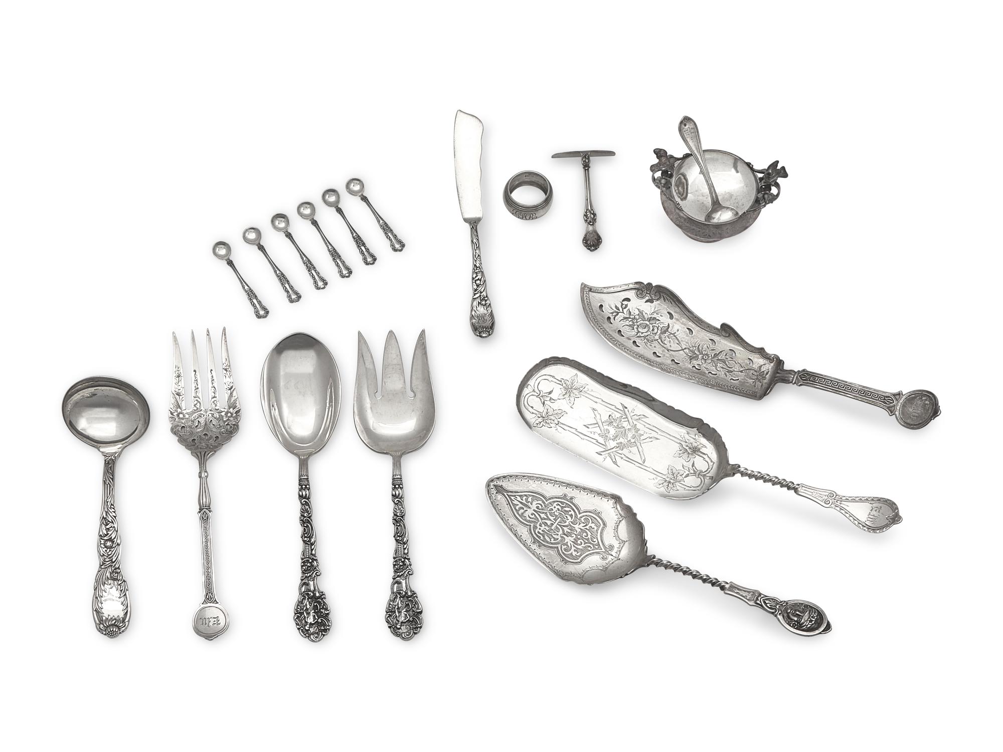 An Assembled Group of Eighteen Sterling Silver and Silver Serving Pieces, Various Makers, Late 19th / Early 20th Century