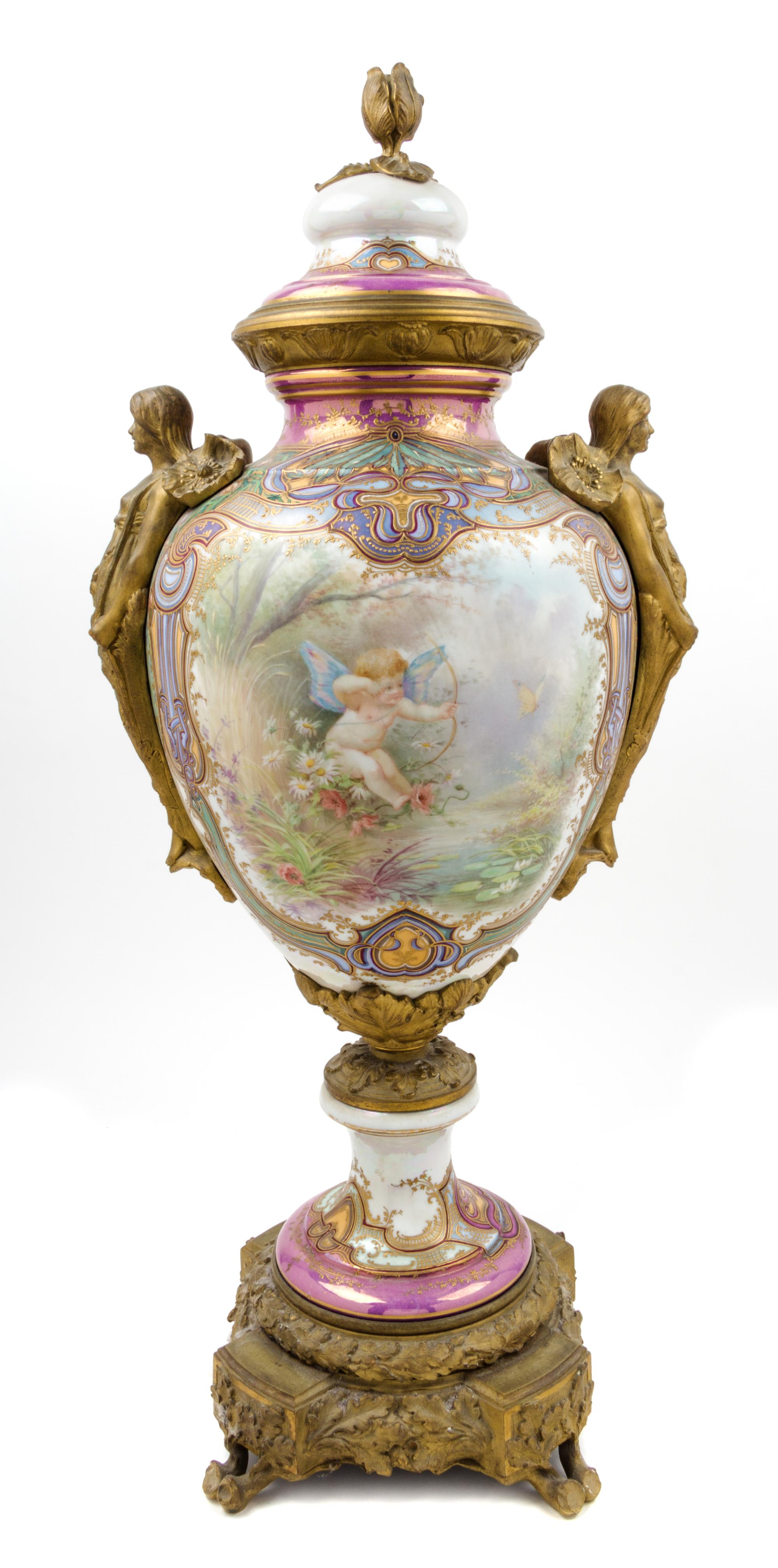 A Sevres Gilt Bronze Mounted Porcelain Urn Height 31 1/2 inches.