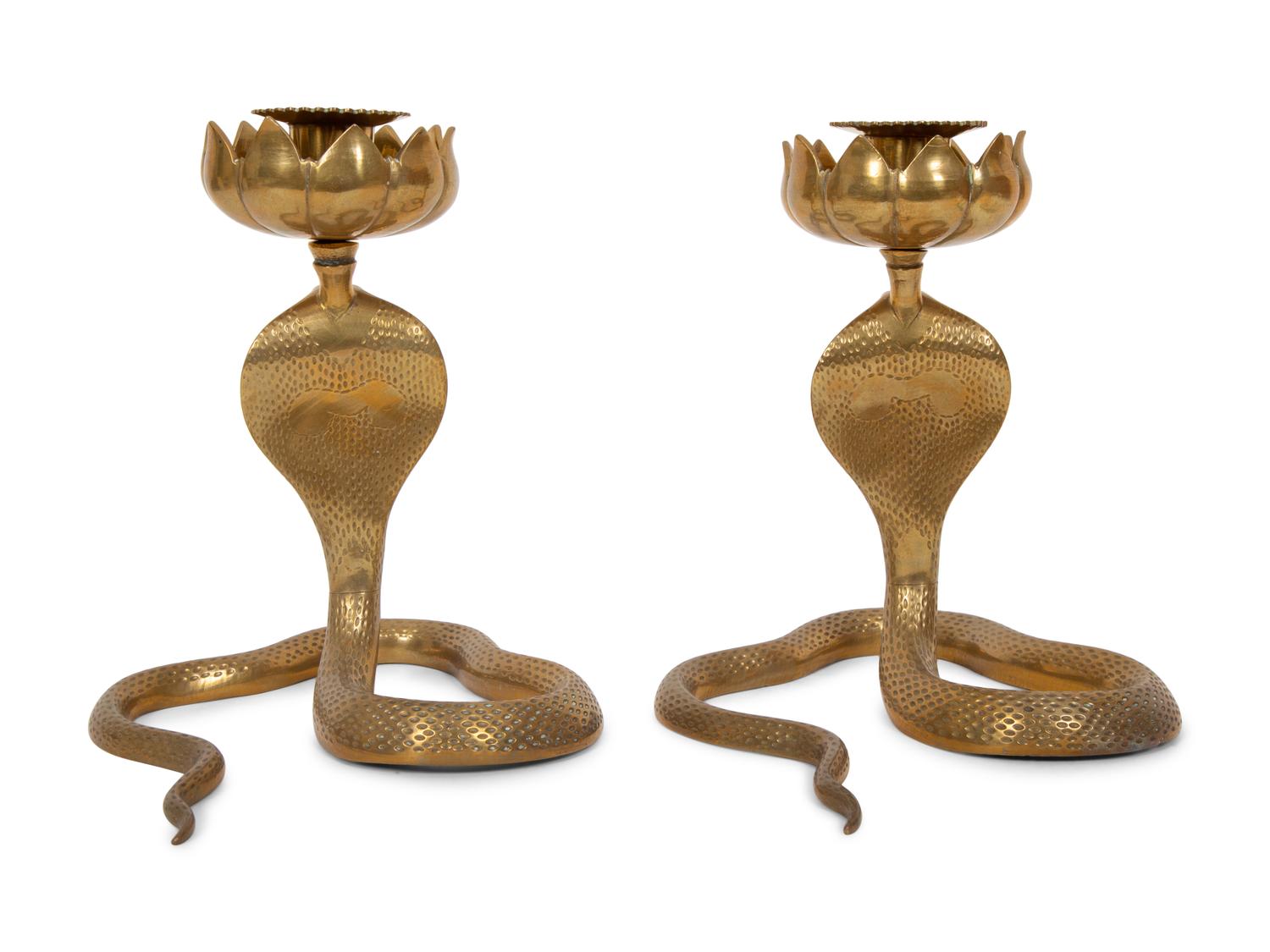 A Pair of Brass Cobra Candlesticks