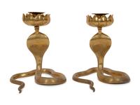 A Pair of Brass Cobra Candlesticks