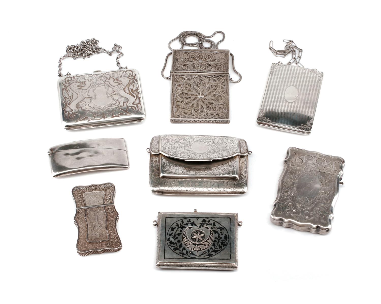 A Collection of Eight Silver Card Cases, Late 19th/Early 20th Century, comprising two unmarked filigree examples, a Niello decorated ex