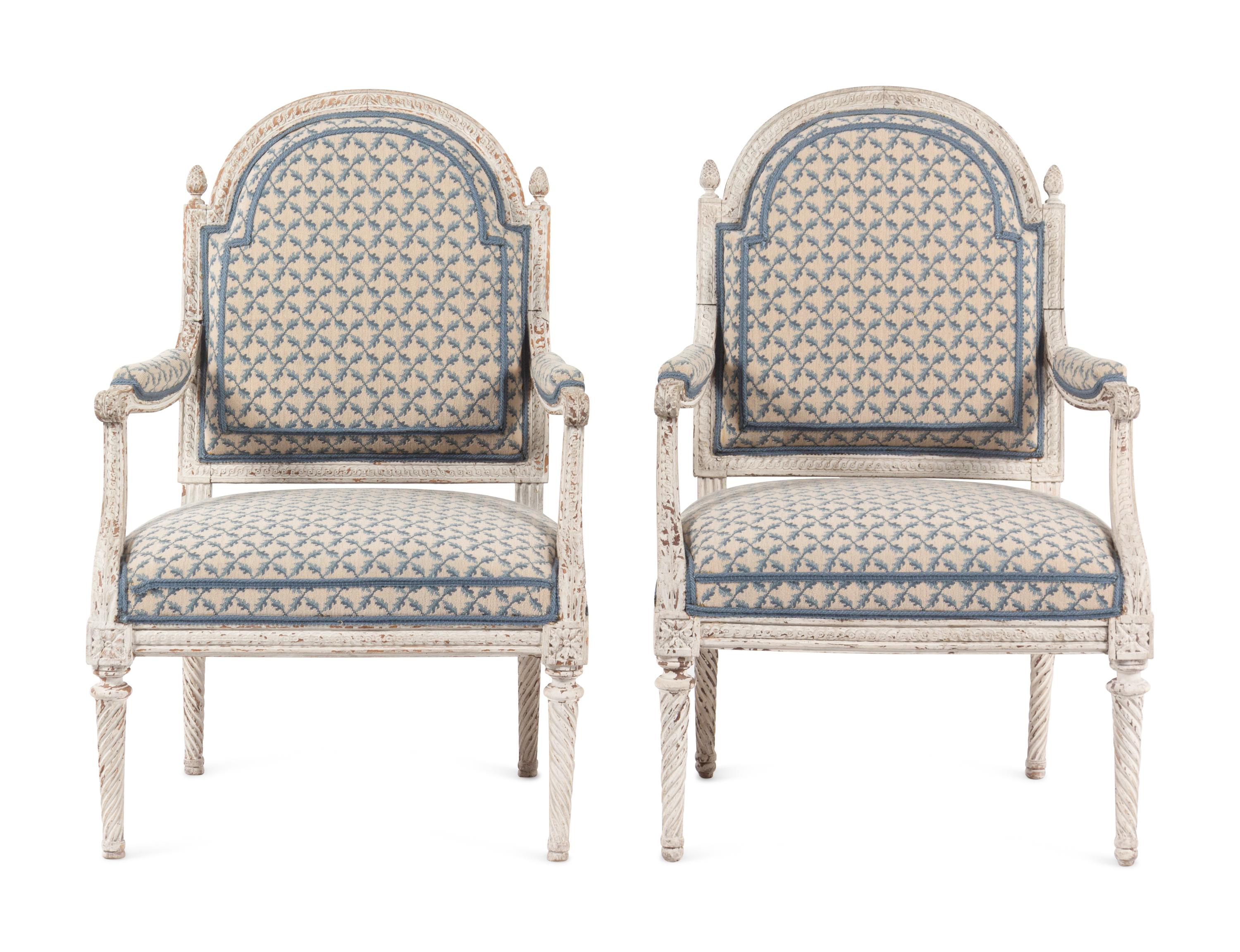 A Pair of Louis XVI Provincial White-Painted Fauteuils
