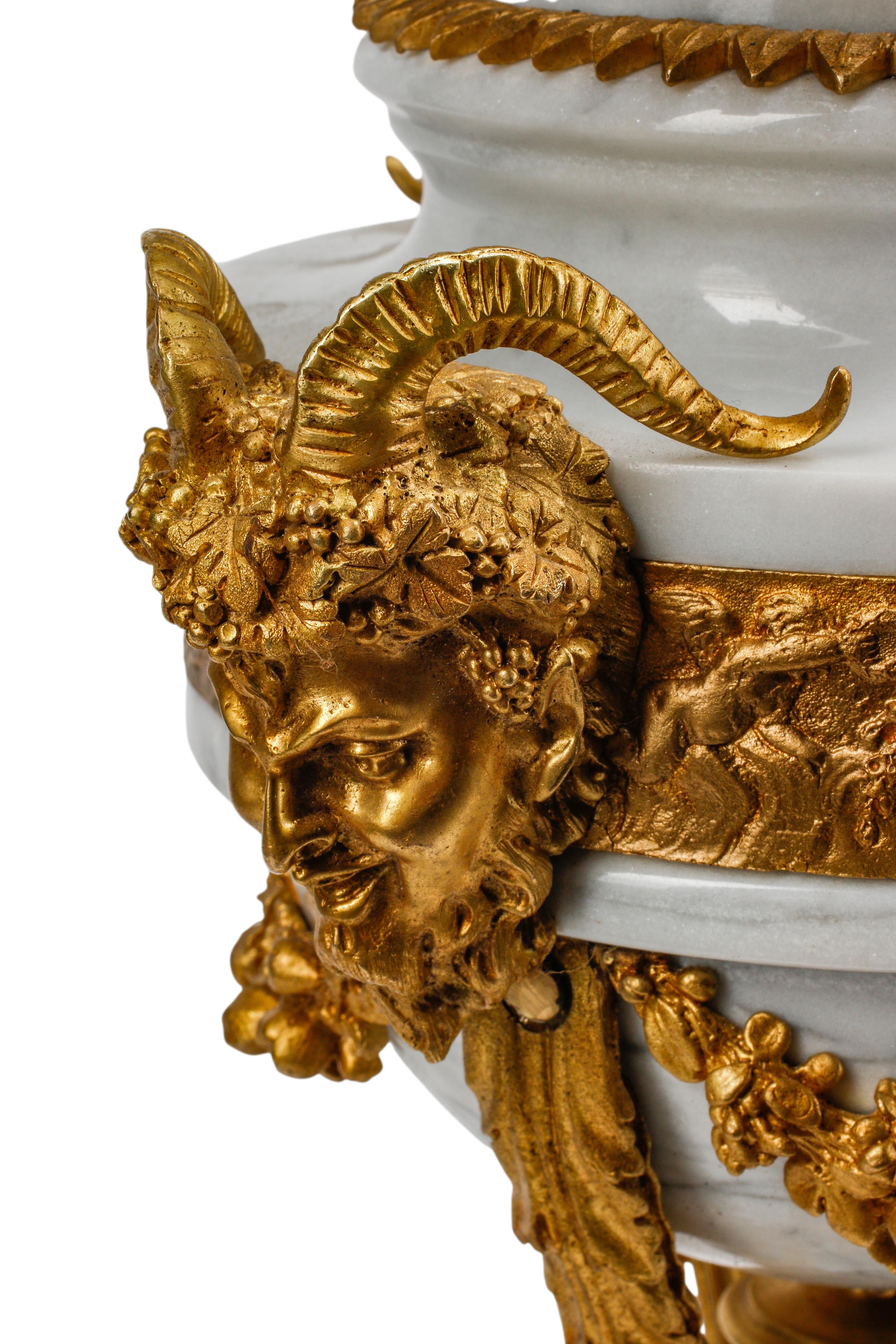 A Pair of Louis XV Style Gilt Bronze and Marble Seven-Light Candelabra