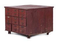A Red Painted Pine Storage Chest on Casters