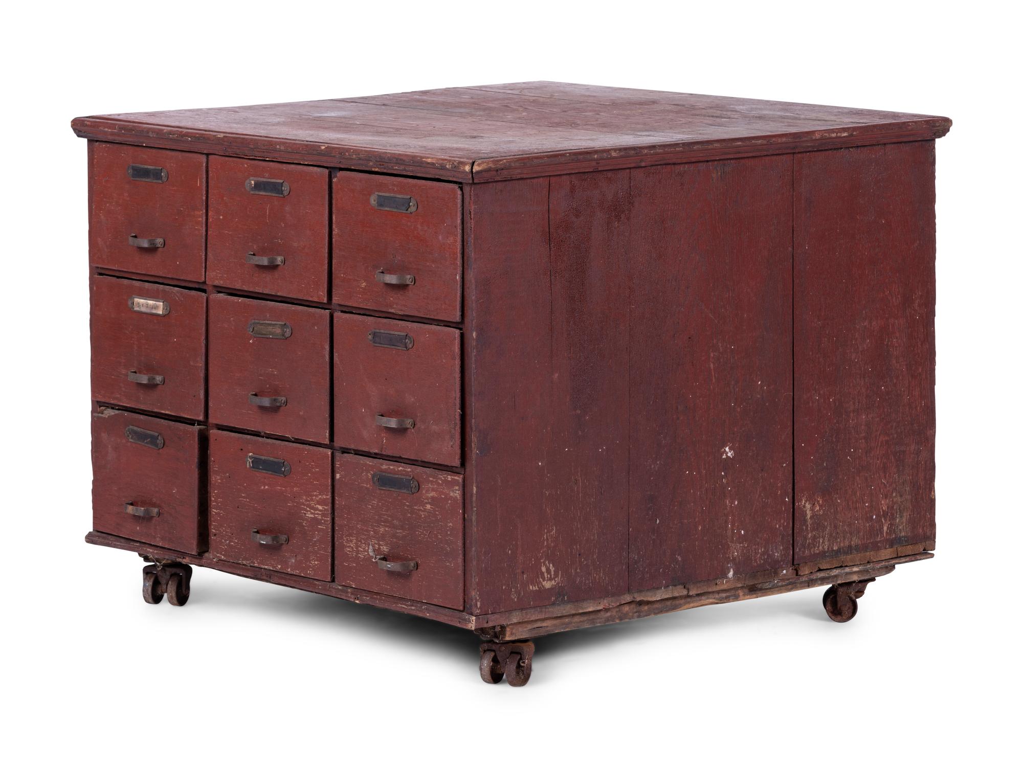 A Red Painted Pine Storage Chest on Casters