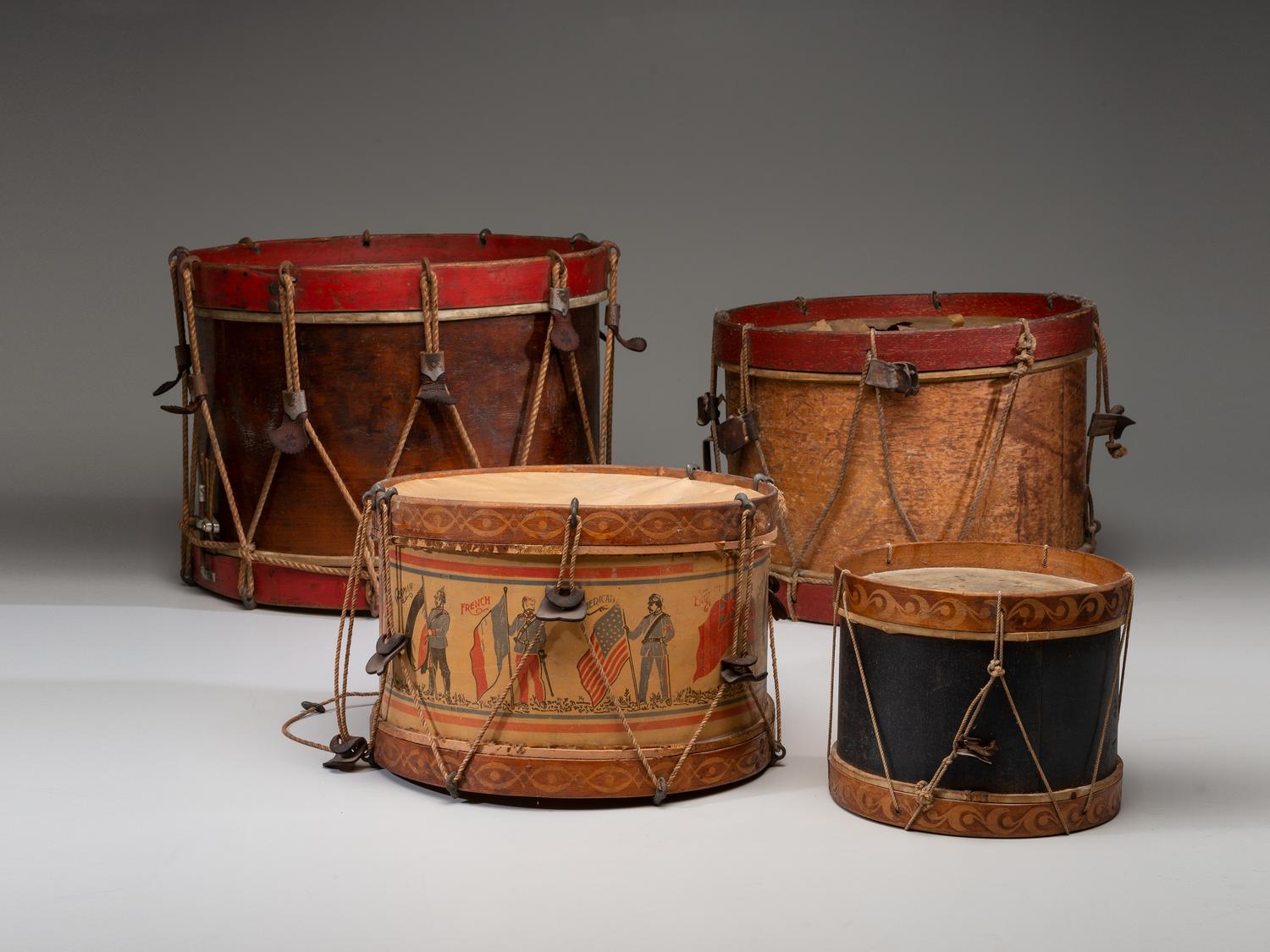 Four Paper and Paint Decorated Drums