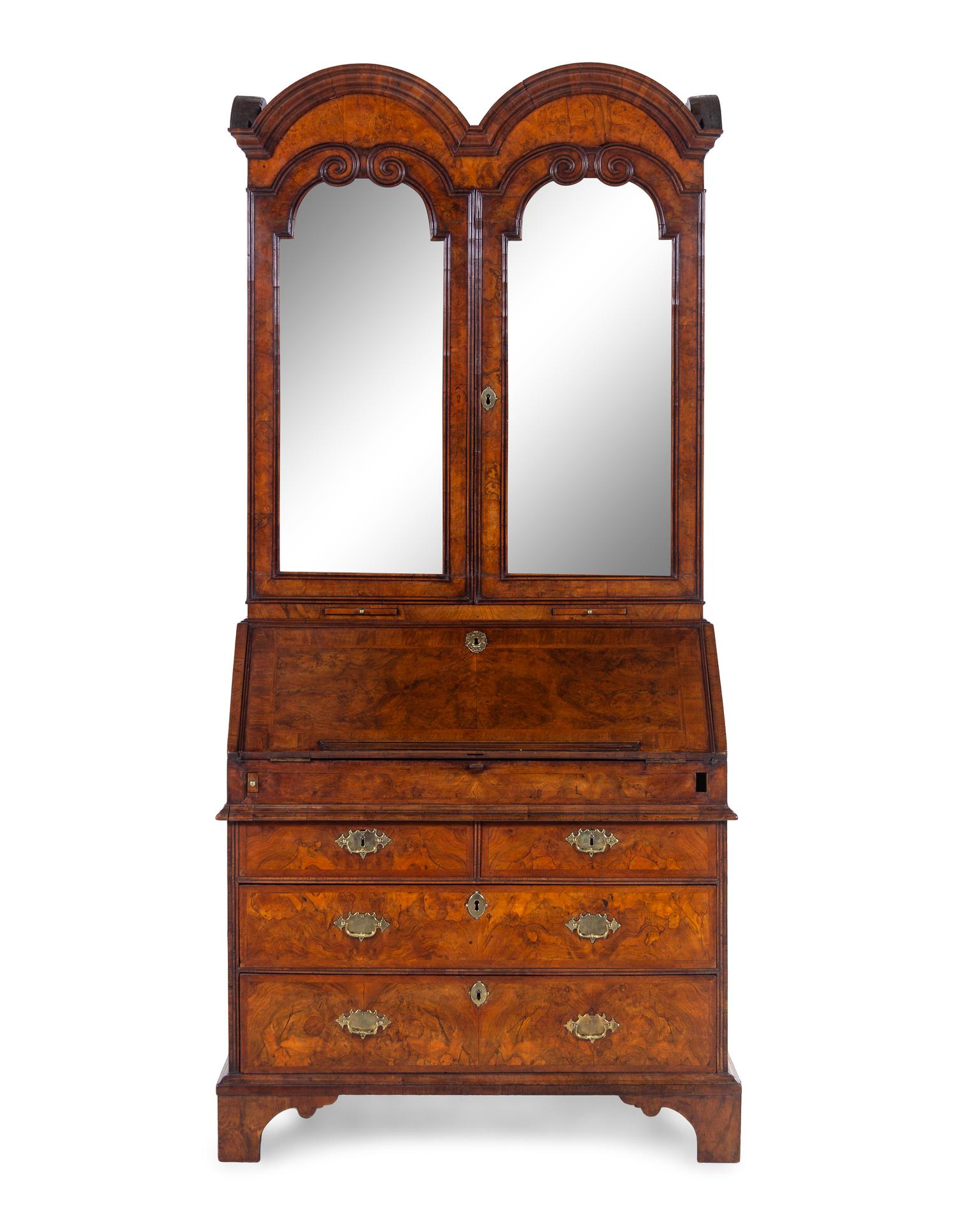 A George I Carved Burl Walnut Double-Dome Bureau Bookcase