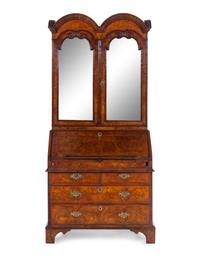 A George I Carved Burl Walnut Double-Dome Bureau Bookcase