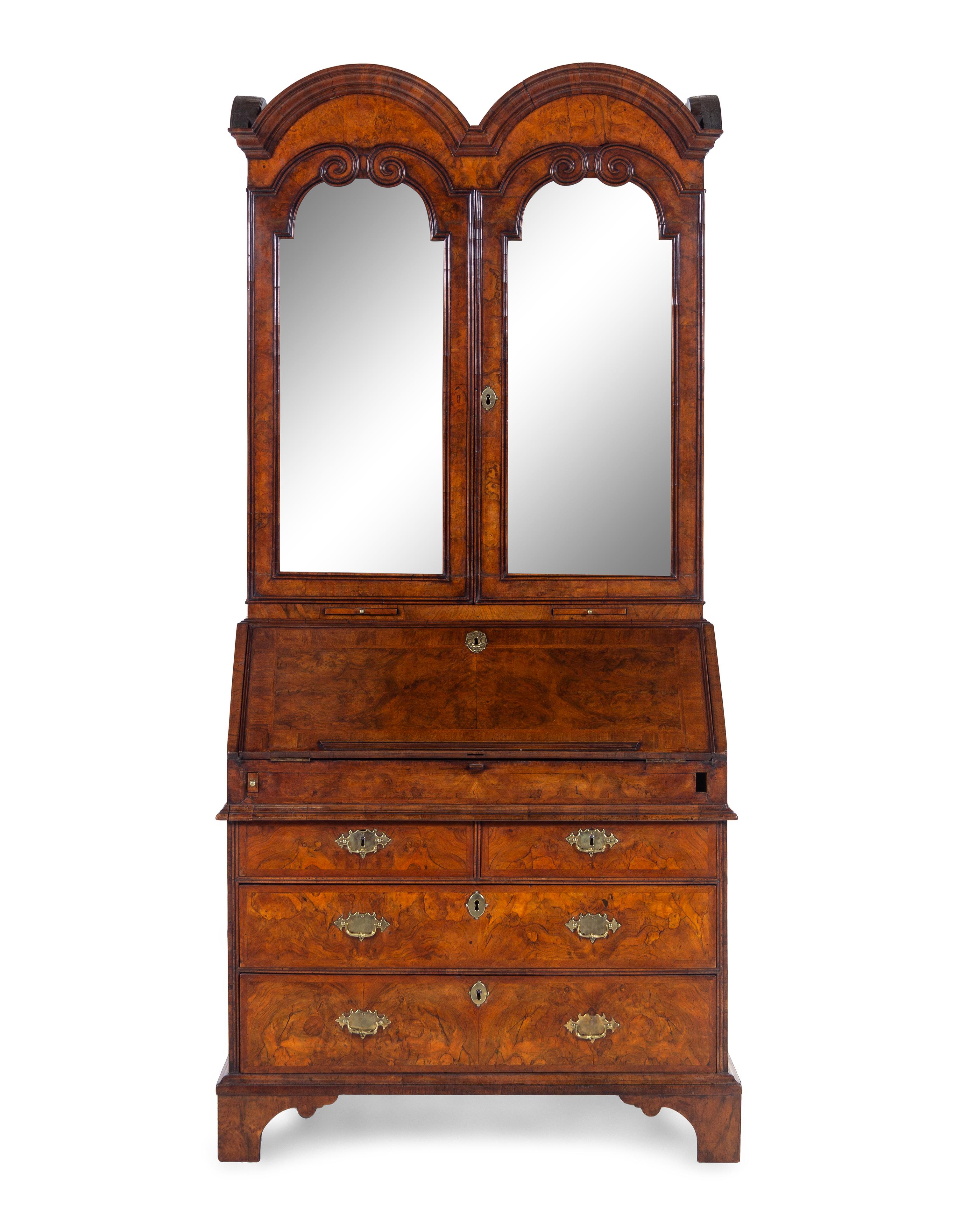 A George I Carved Burl Walnut Double-Dome Bureau Bookcase