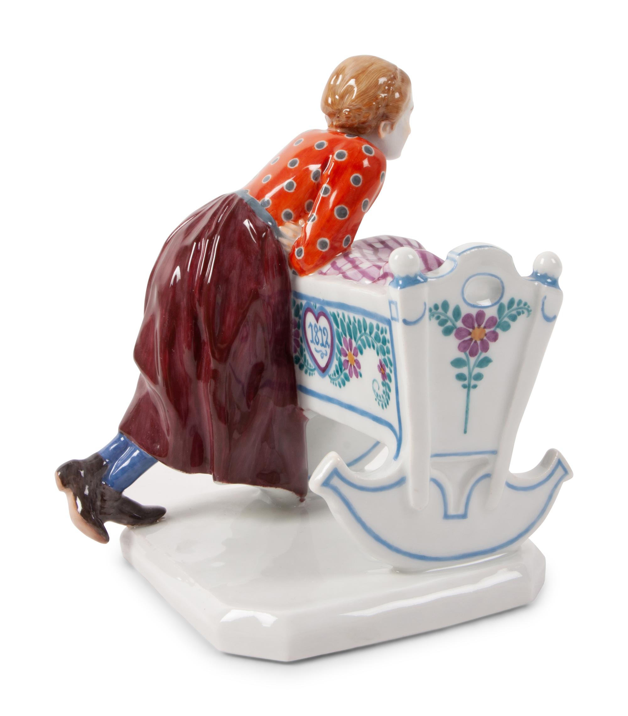 A Meissen Porcelain Figural Group of a Woman with Cradle
