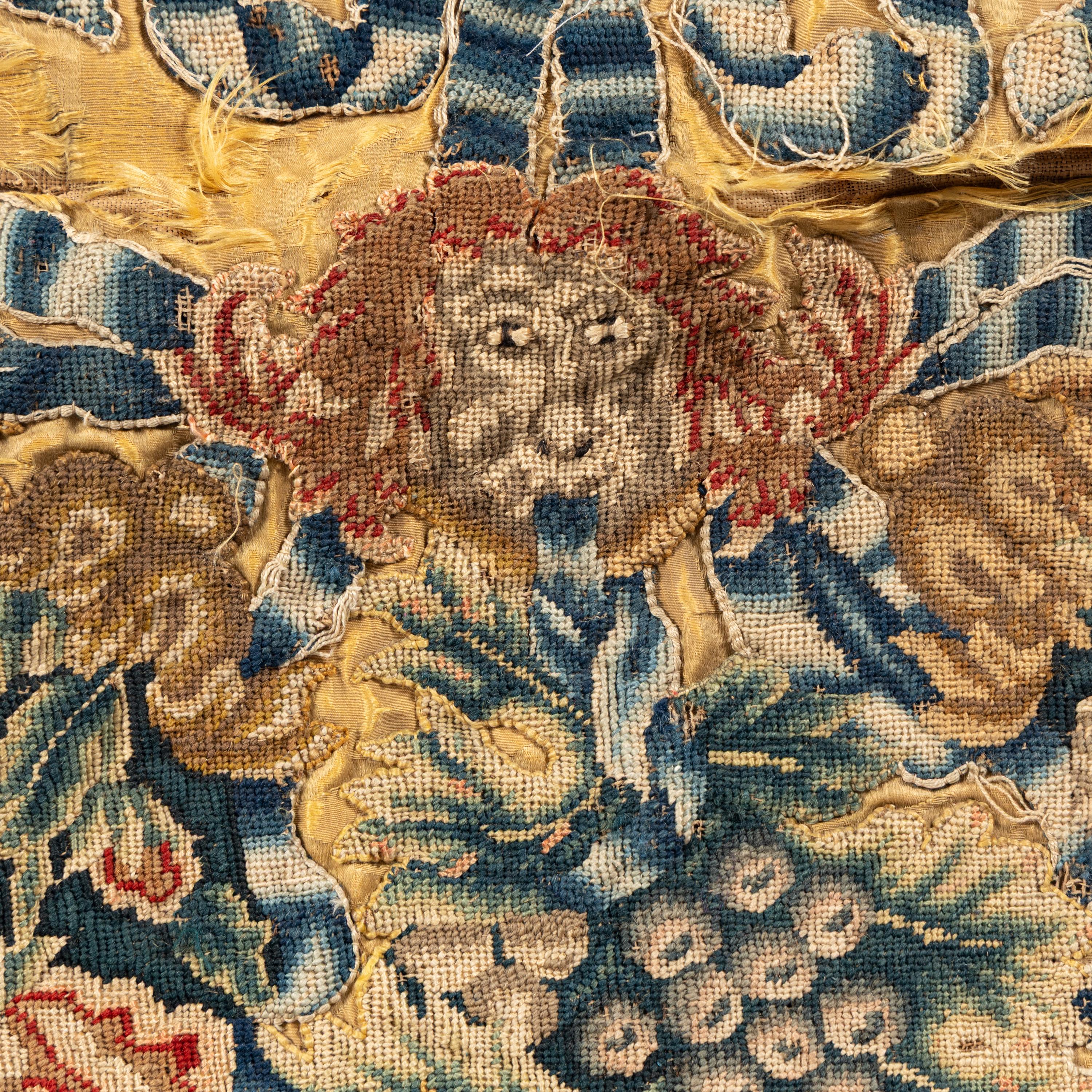 A Gold Silk Damask Panel with Needlework Appliqu é , Now Mounted as a Cushion Cover