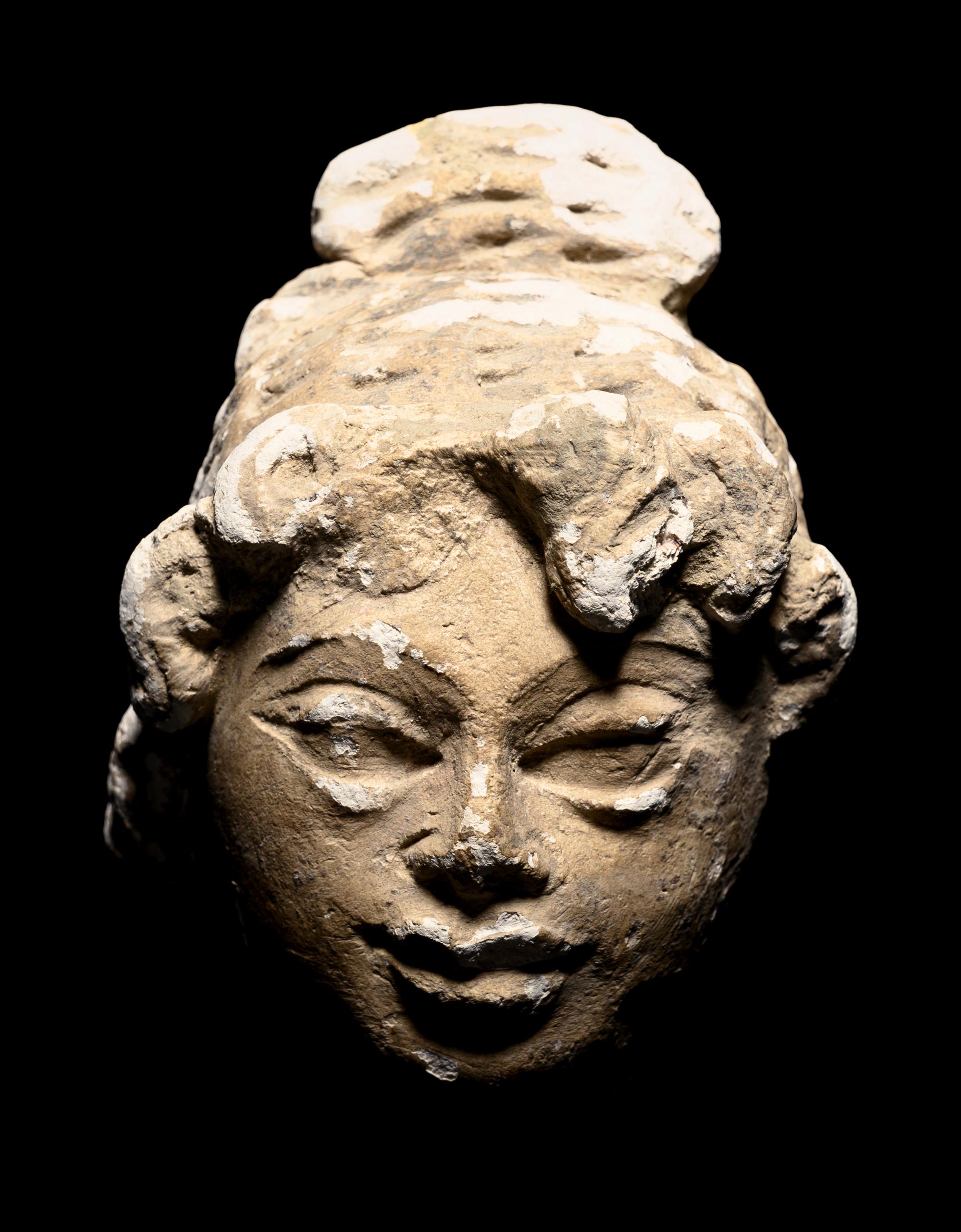 Three Gandharan Fragmentary Stucco Heads and One European Fragmentary Stucco Head