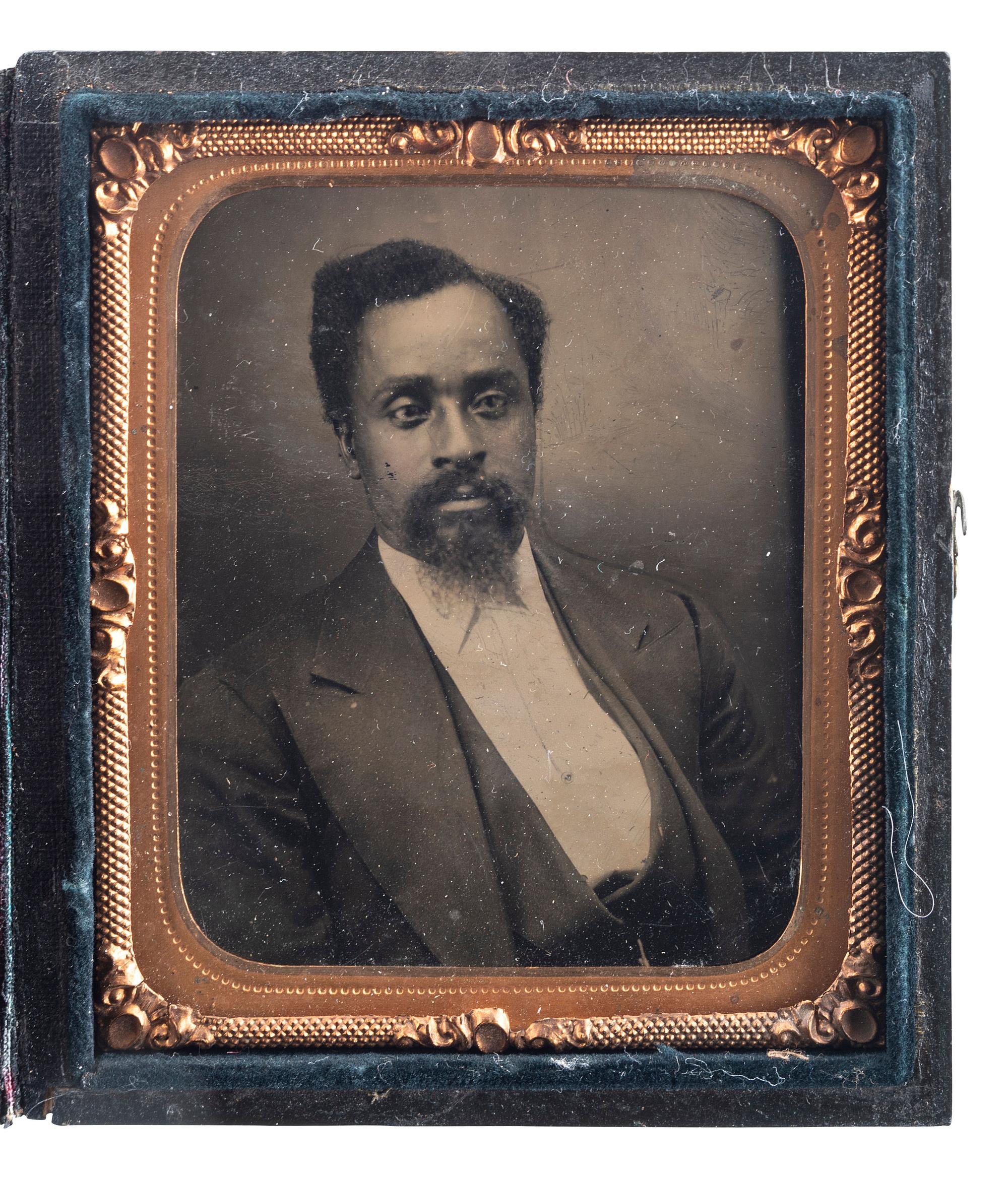 [EARLY PHOTOGRAPHY]. A group of 2 sixth plate tintypes of handsome African American gentlemen, comprising: