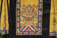 A Chinese Lady's Embroidered Silk Jacket and A Yellow Ground Silk Apron Skirt