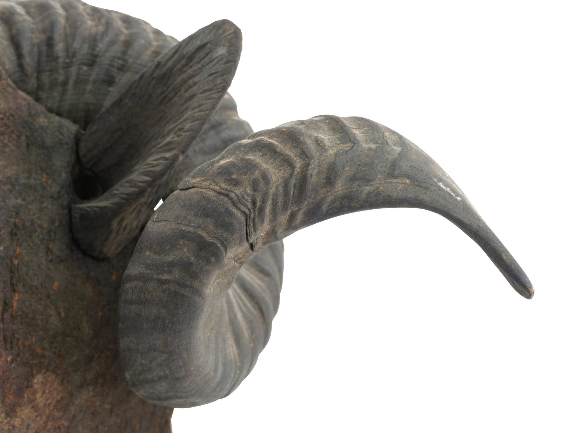 A Carved Walnut Ram's Head