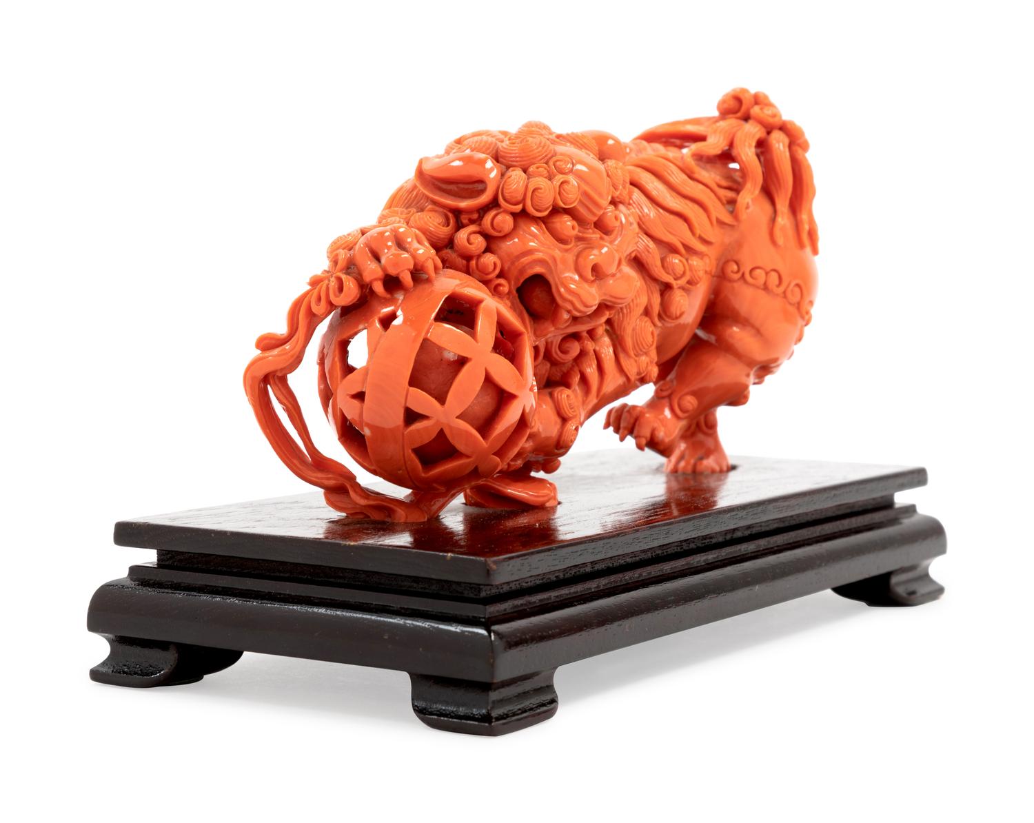 A Carved Coral Figure of a Lion
