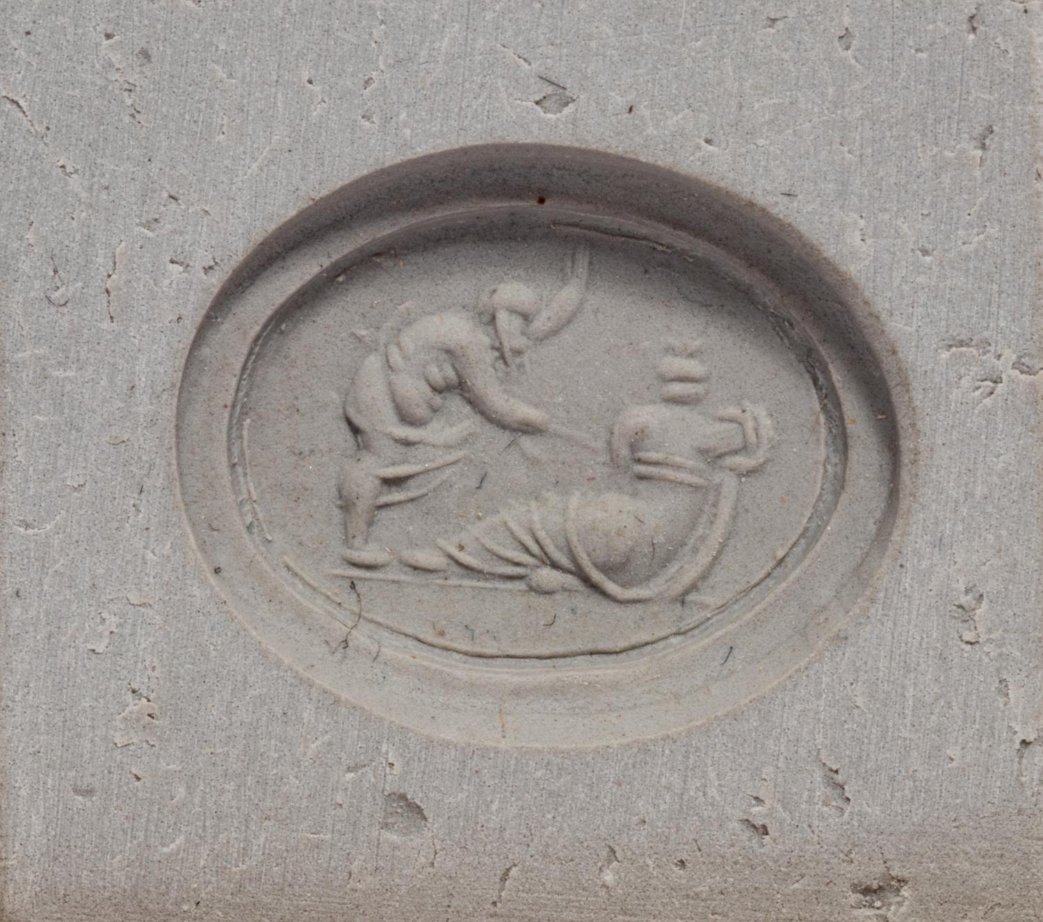 A Roman Carnelian Ring Stone with the God Silenus Surprising a Sleeping Woman — Set in a gold ring