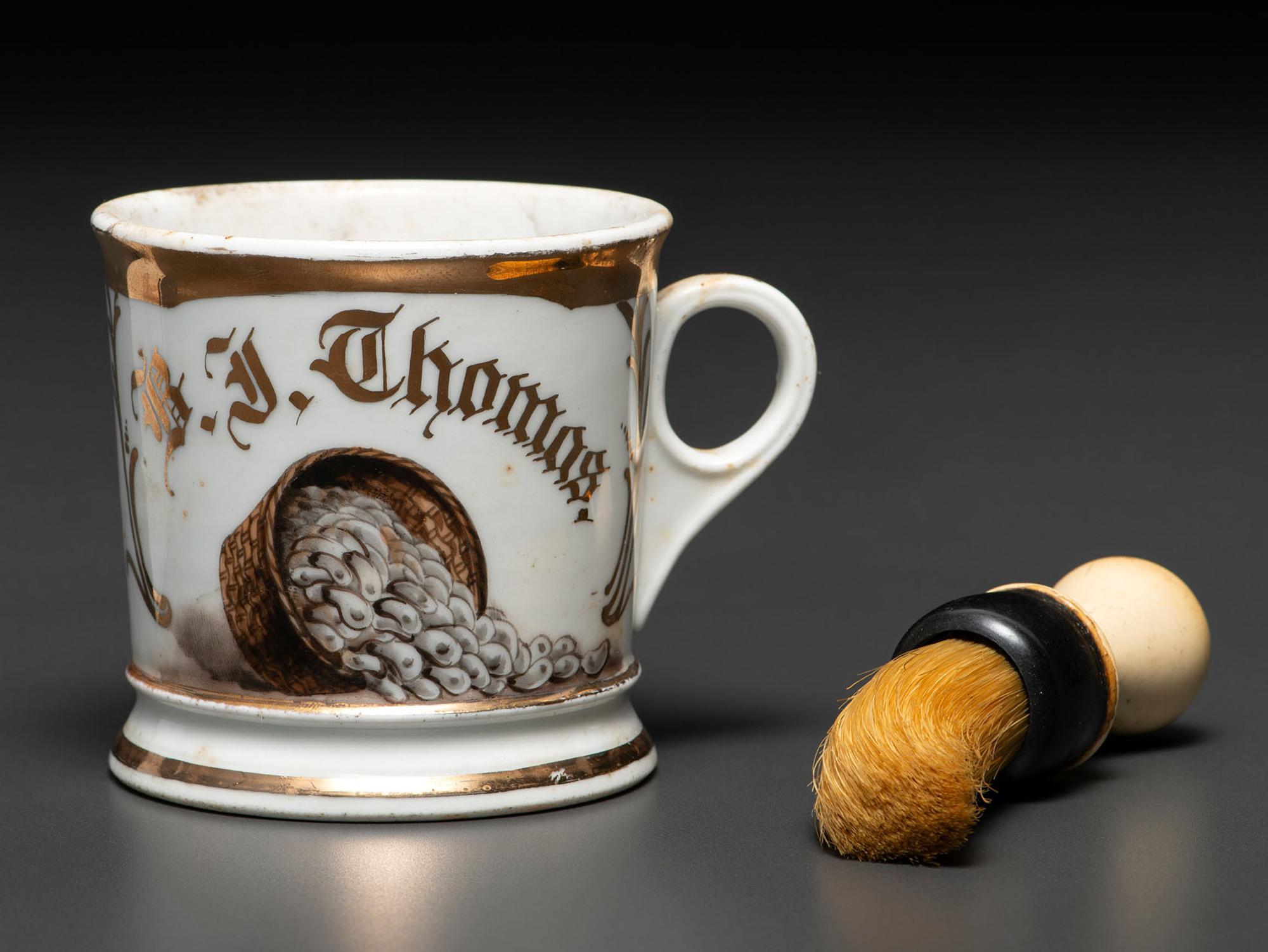 A Porcelain Occupational Shaving Mug Depicting a Bushel of Oysters