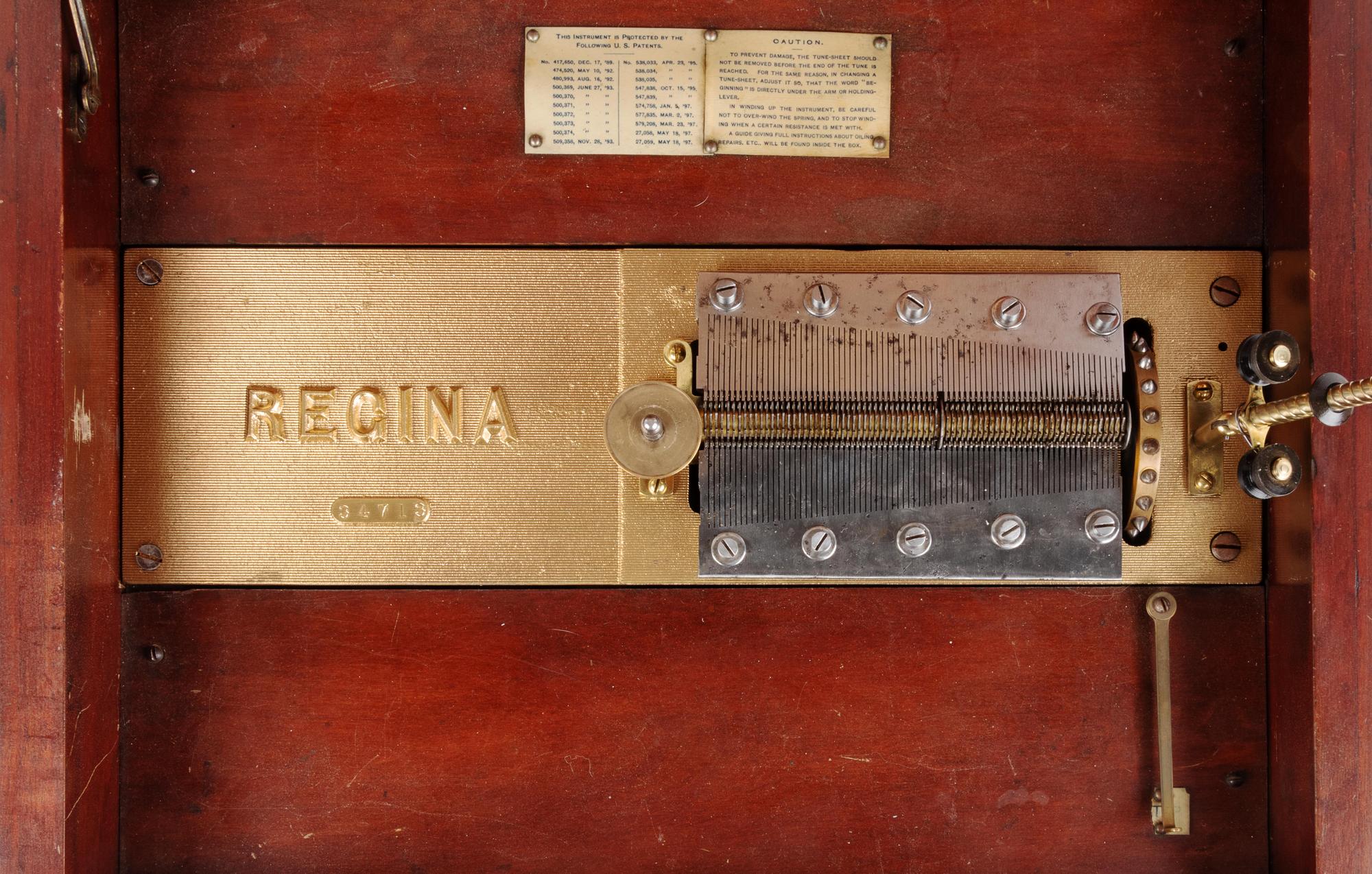 A Regina 15 1/2-Inch Double-Comb Disk Oak Music Box